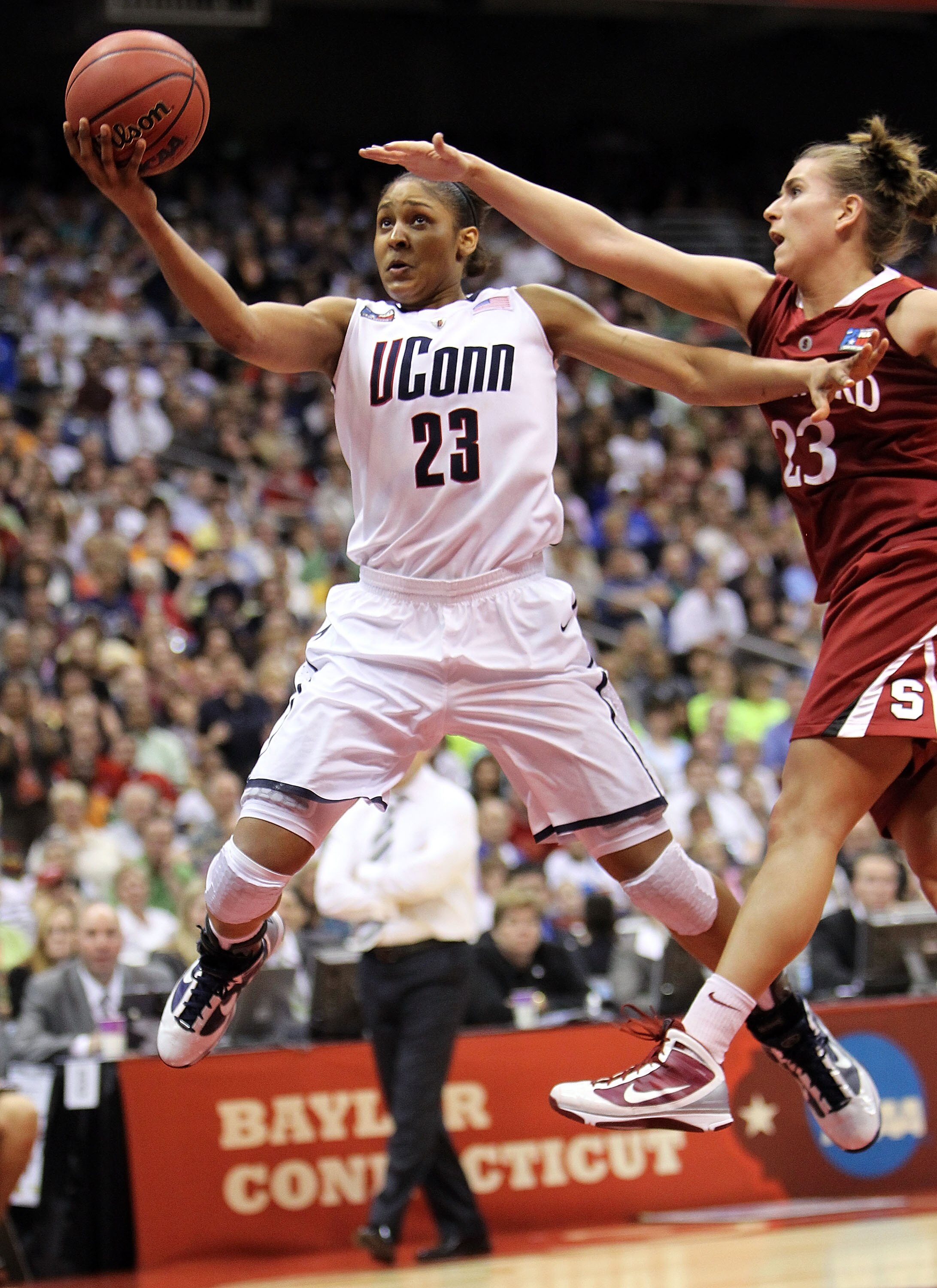 SAN ANTONIO - APRIL 06: Forward Maya Moore #23 of the Connecticut Huskies takes a shot against Jeanette Pohlen #23 of the Stanford Cardinal during the NCAA Women's Final Four Championship game at the Alamodome on April 6, 2010 in San Antonio, Texas. (Ph SAN ANTONIO - APRIL 06: Forward Maya Moore #23 of the Connecticut Huskies takes a shot against Jeanette Pohlen #23 of the Stanford Cardinal during the NCAA Women's Final Four Championship game at the Alamodome on April 6, 2010 in San Antonio, Texas. (Ph