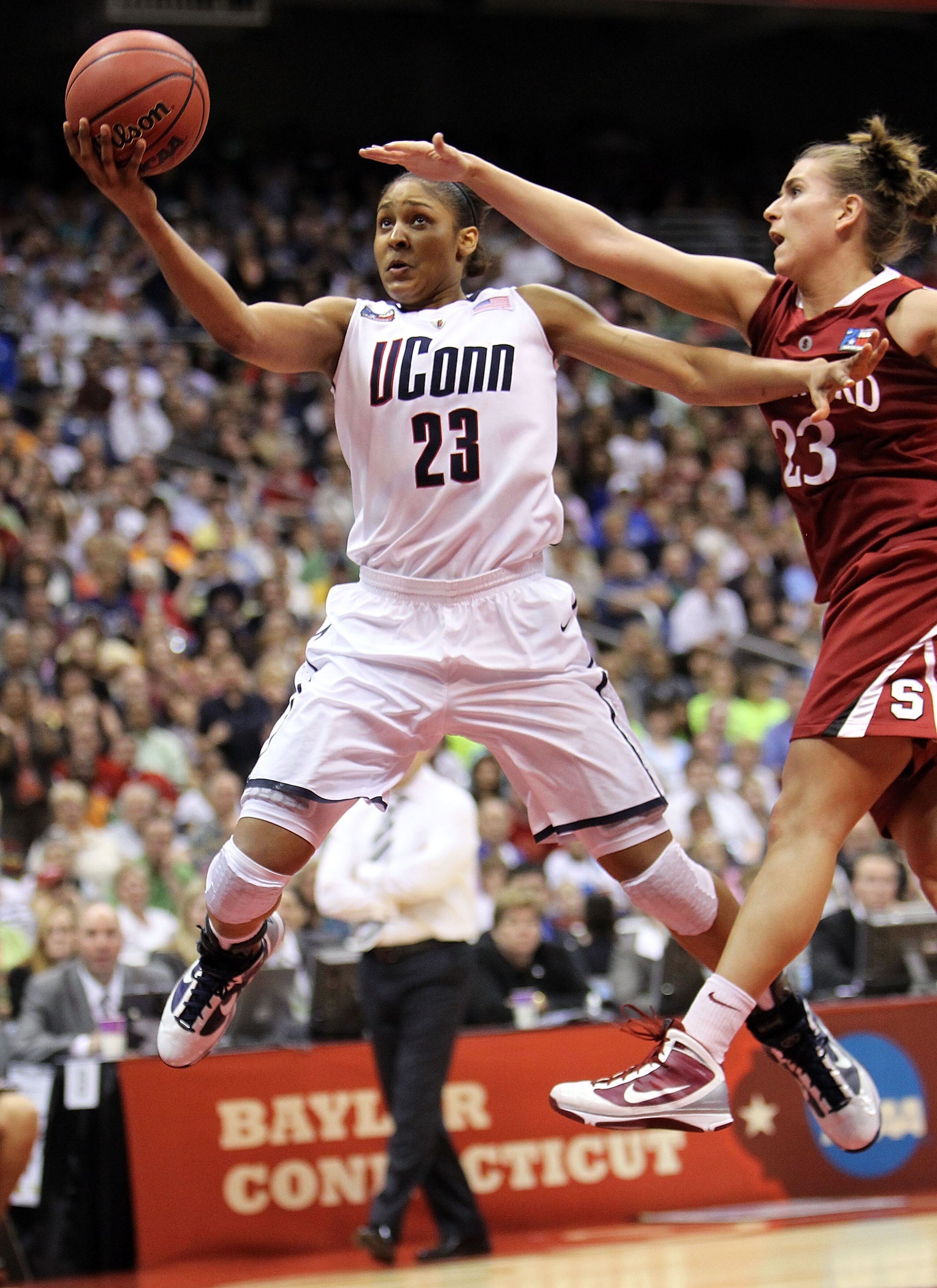 SAN ANTONIO - APRIL 06:  Forward Maya Moore #23 of the Connecticut Huskies takes a shot against Jeanette Pohlen #23 of the Stanford Cardinal during the NCAA Women's Final Four Championship game at the Alamodome on April 6, 2010 in San Antonio, Texas.  (Ph
