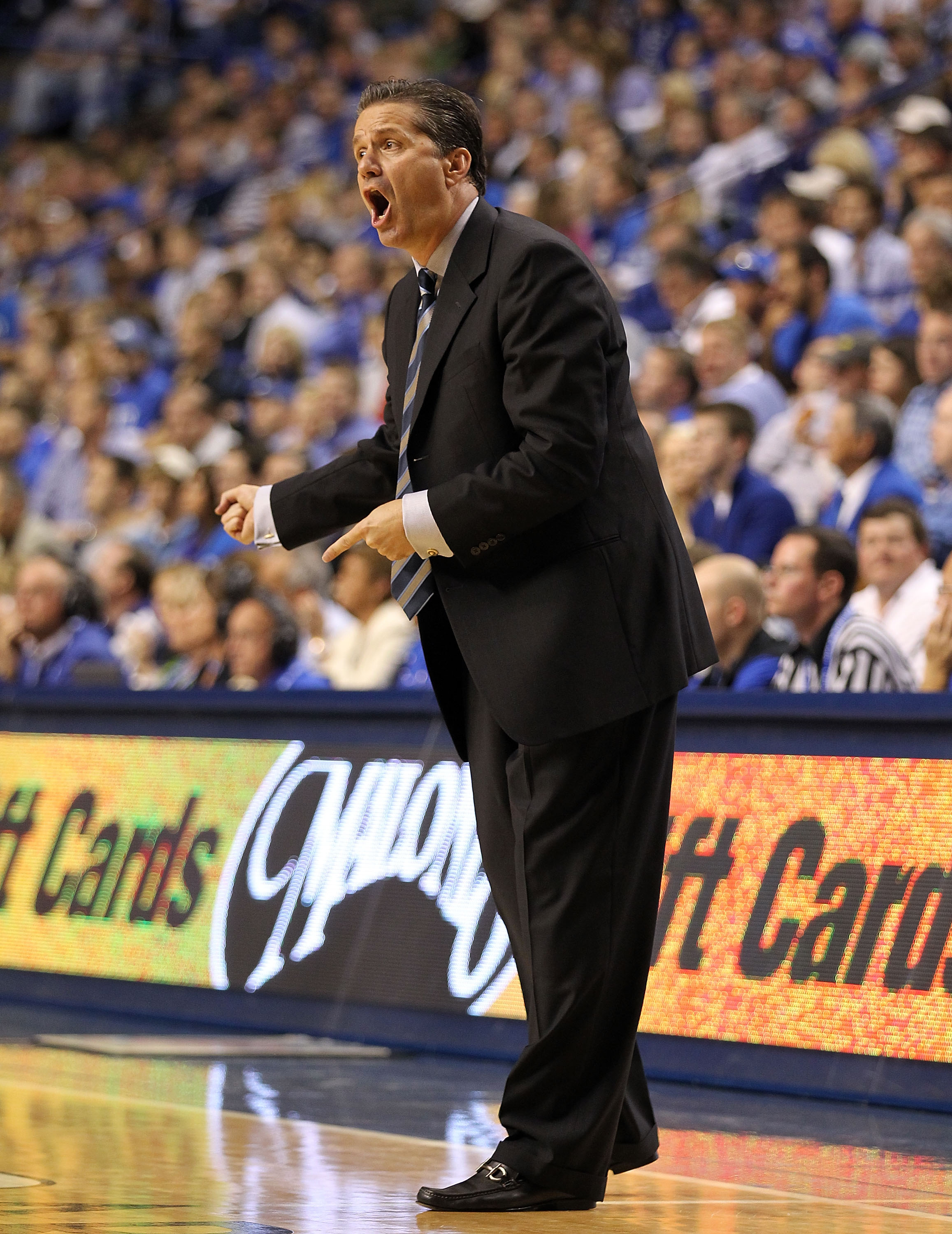 LEXINGTON, KY - NOVEMBER 12: John Calipari the Head Coach of the Kentucky Wildcats gives instructions to his team during the game against East Tennessee State Buccaneers at Rupp Arena on November 12, 2010 in Lexington, Kentucky. (Photo by Andy Lyons/G LEXINGTON, KY - NOVEMBER 12: John Calipari the Head Coach of the Kentucky Wildcats gives instructions to his team during the game against East Tennessee State Buccaneers at Rupp Arena on November 12, 2010 in Lexington, Kentucky. (Photo by Andy Lyons/G