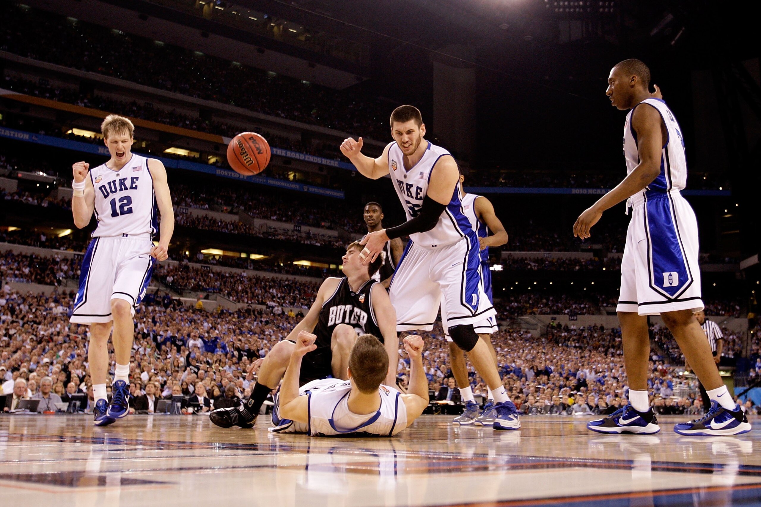INDIANAPOLIS - APRIL 05:  (L-R) Kyle Singler #12, Jon Scheyer #30, Brian Zoubek #55 and Nolan Smith #2 of the Duke Blue Devils celebrate after Scheyer drew a charging foul against Gordon Hayward #20 of the Butler Bulldogs during the 2010 NCAA Division I M