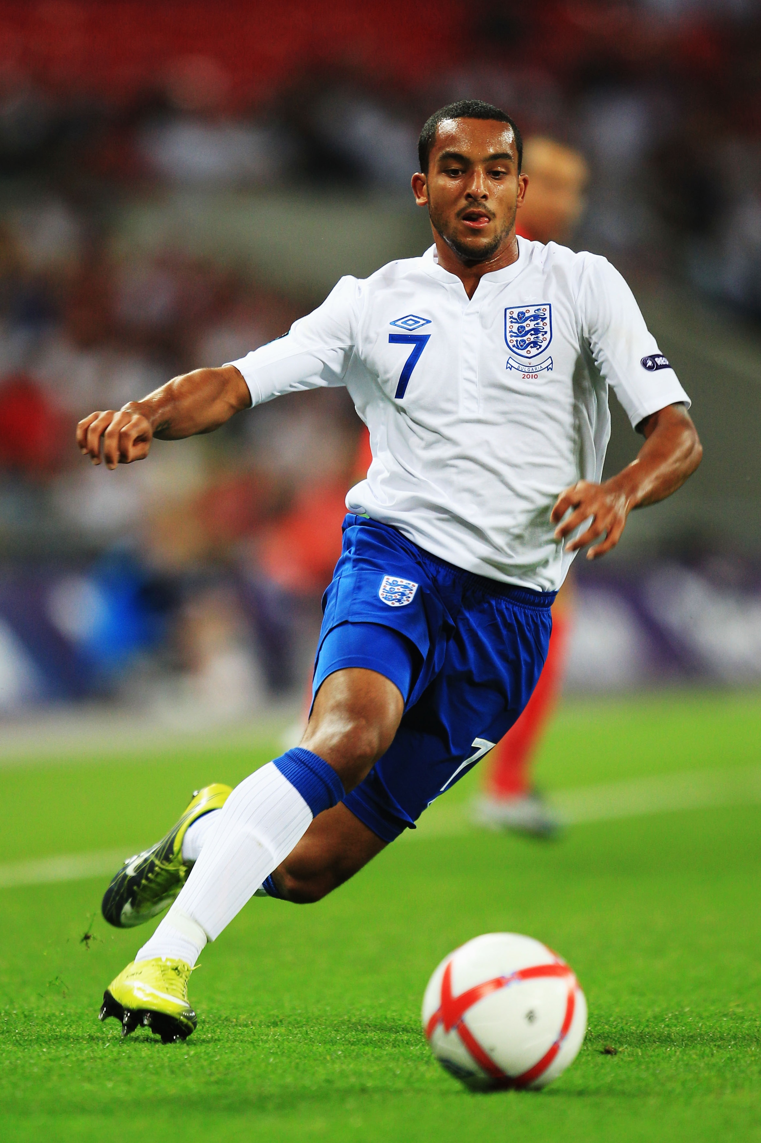 LONDON, ENGLAND - SEPTEMBER 03:  Theo Walcott of England runs with the ball during the UEFA EURO 2012 Group G Qualifying match between England and Bulgaria at Wembley Stadium on September 3, 2010 in London, England.  (Photo by Mark Thompson/Getty Images)