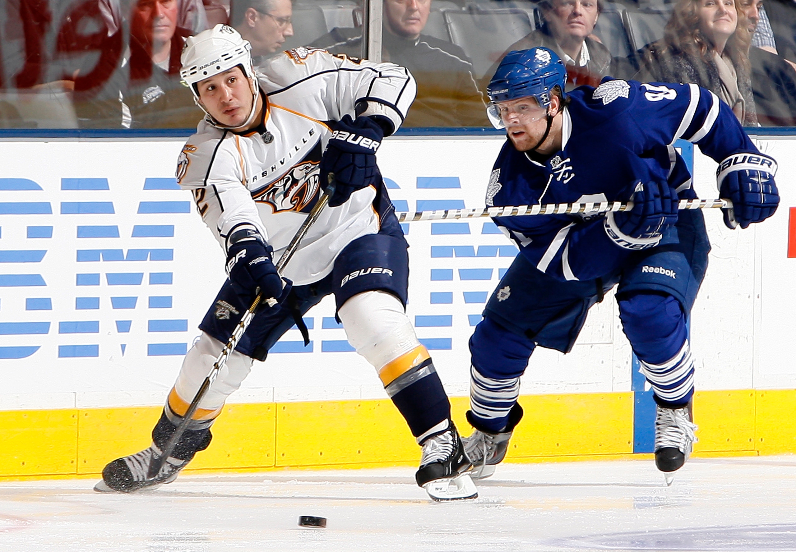 TORONTO - NOVEMBER 16: Phil Kessel #81 of the Toronto Maple Leafs hooks Jordin Tootoo #22 of the Nashville Predators during game action at the Air Canada Centre November 16, 2010 in Toronto, Ontario, Canada. (Photo by Abelimages/Getty Images)