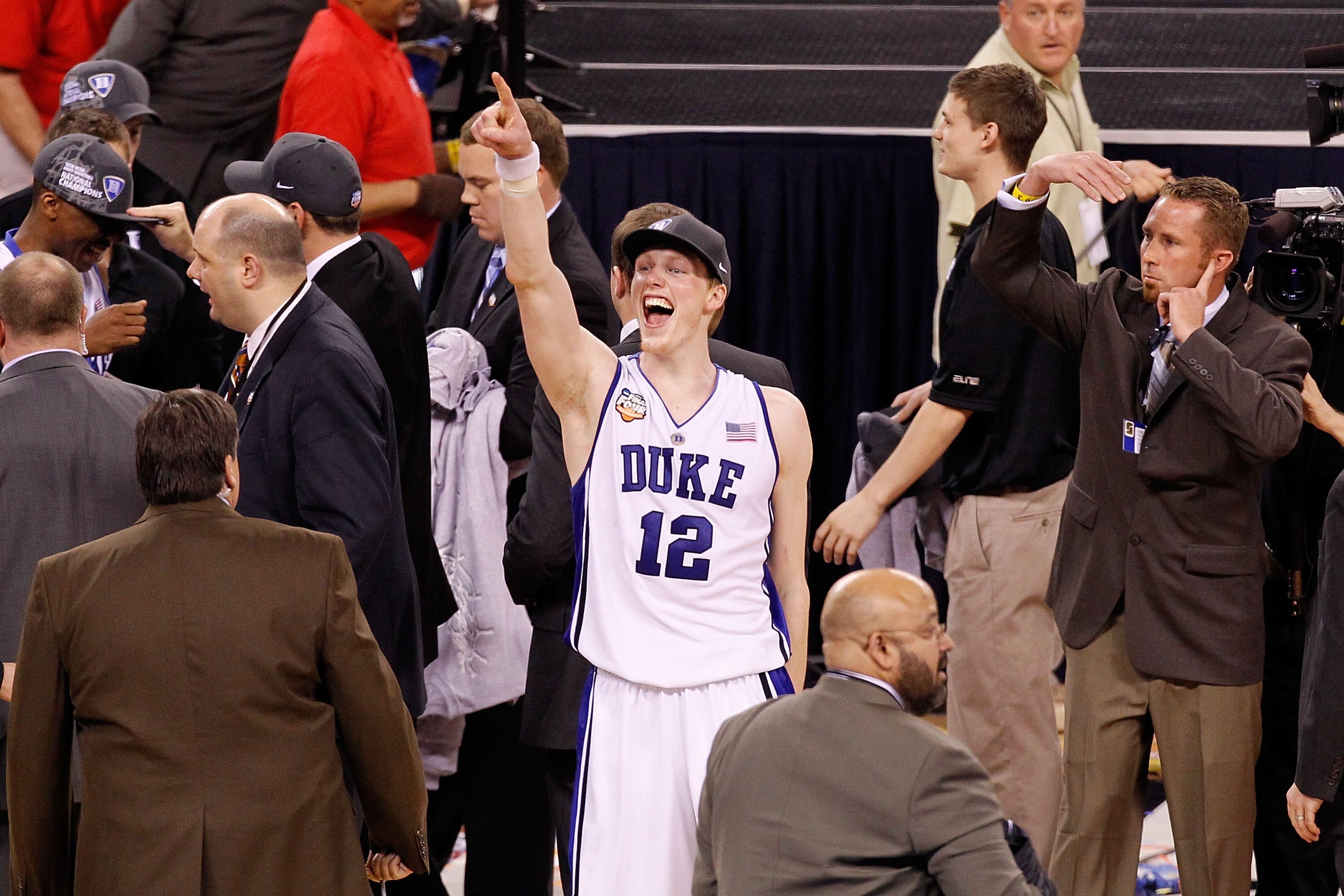 INDIANAPOLIS - APRIL 05: Kyle Singler #12 of the Duke Blue Devils celebrates after Duke won 61-59 against the Butler Bulldogs during the 2010 NCAA Division I Men's Basketball National Championship game at Lucas Oil Stadium on April 5, 2010 in Indianapoli INDIANAPOLIS - APRIL 05: Kyle Singler #12 of the Duke Blue Devils celebrates after Duke won 61-59 against the Butler Bulldogs during the 2010 NCAA Division I Men's Basketball National Championship game at Lucas Oil Stadium on April 5, 2010 in Indianapoli