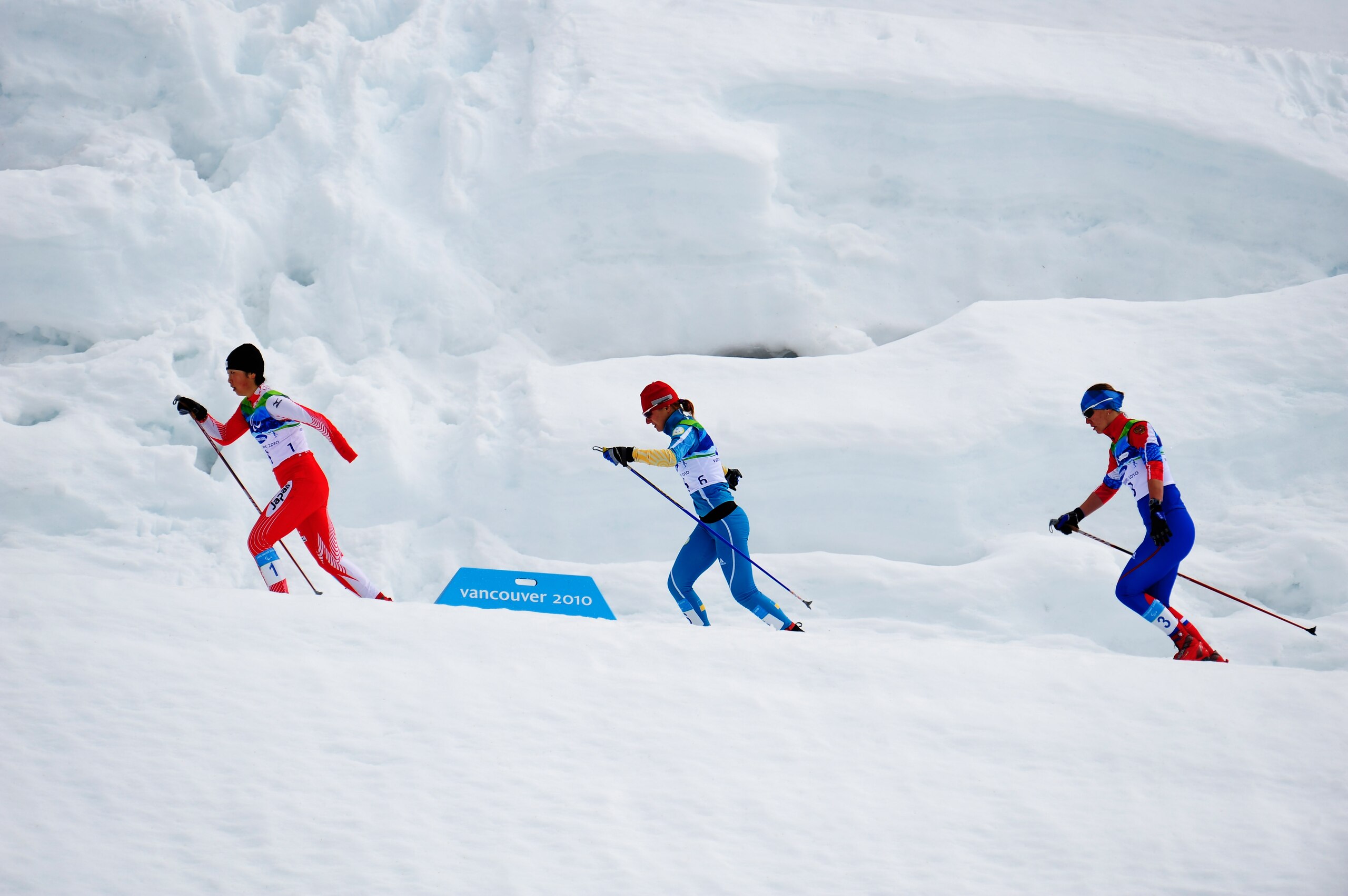 WHISTLER, BC - MARCH 21:  (L-R) Shoko Ota of Japan, Oleksandra Kononova of Ukraine and Anna Burmistrova of Russia compete in the Women's 1km Standing Cross-Country Sprint Final during Day 10 of the 2010 Vancouver Winter Paralympics at Whistler Paralympic