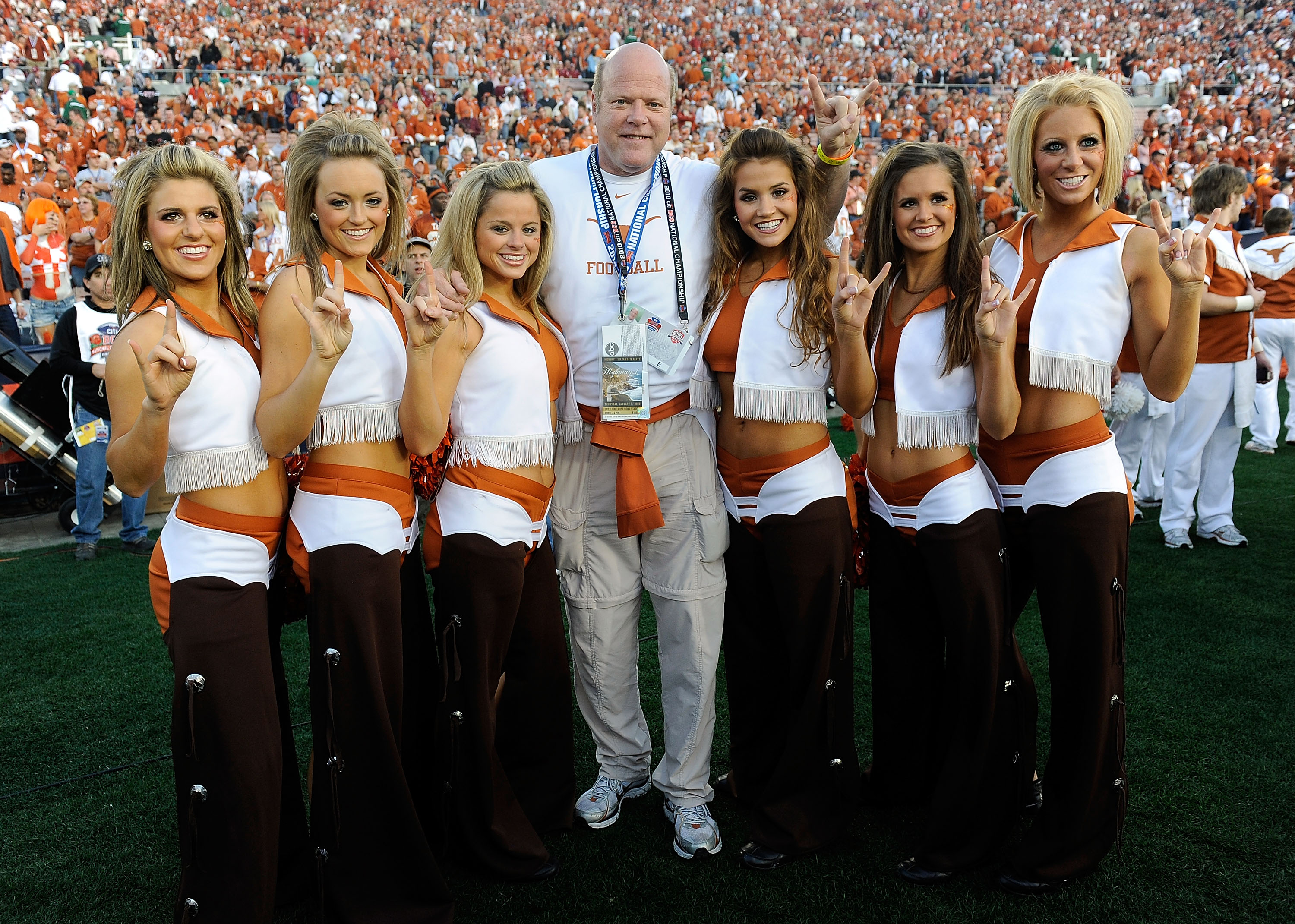PASADENA, CA - JANUARY 07:  Actor Rex Linn stands stands with the Texas Longhorns cheerleaders prior to the Citi BCS National Championship game between the Longhorns and the Alabama Crimson Tide at the Rose Bowl on January 7, 2010 in Pasadena, California.