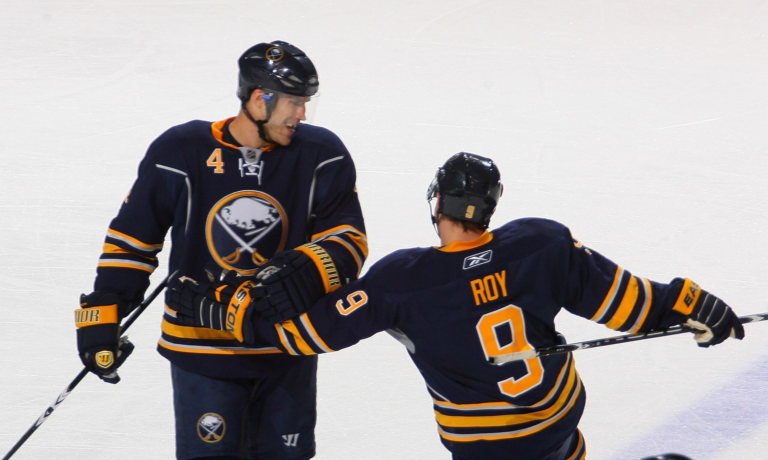 BUFFALO, NY - NOVEMBER 15: Steve Montador #4 and Derek Roy #9  of the Buffalo Sabres celebrate Montador's goal in the second period against the Vancouver Canucks at HSBC Arena on November 15, 2010 in Buffalo, New York.  (Photo by Rick Stewart/Getty Images