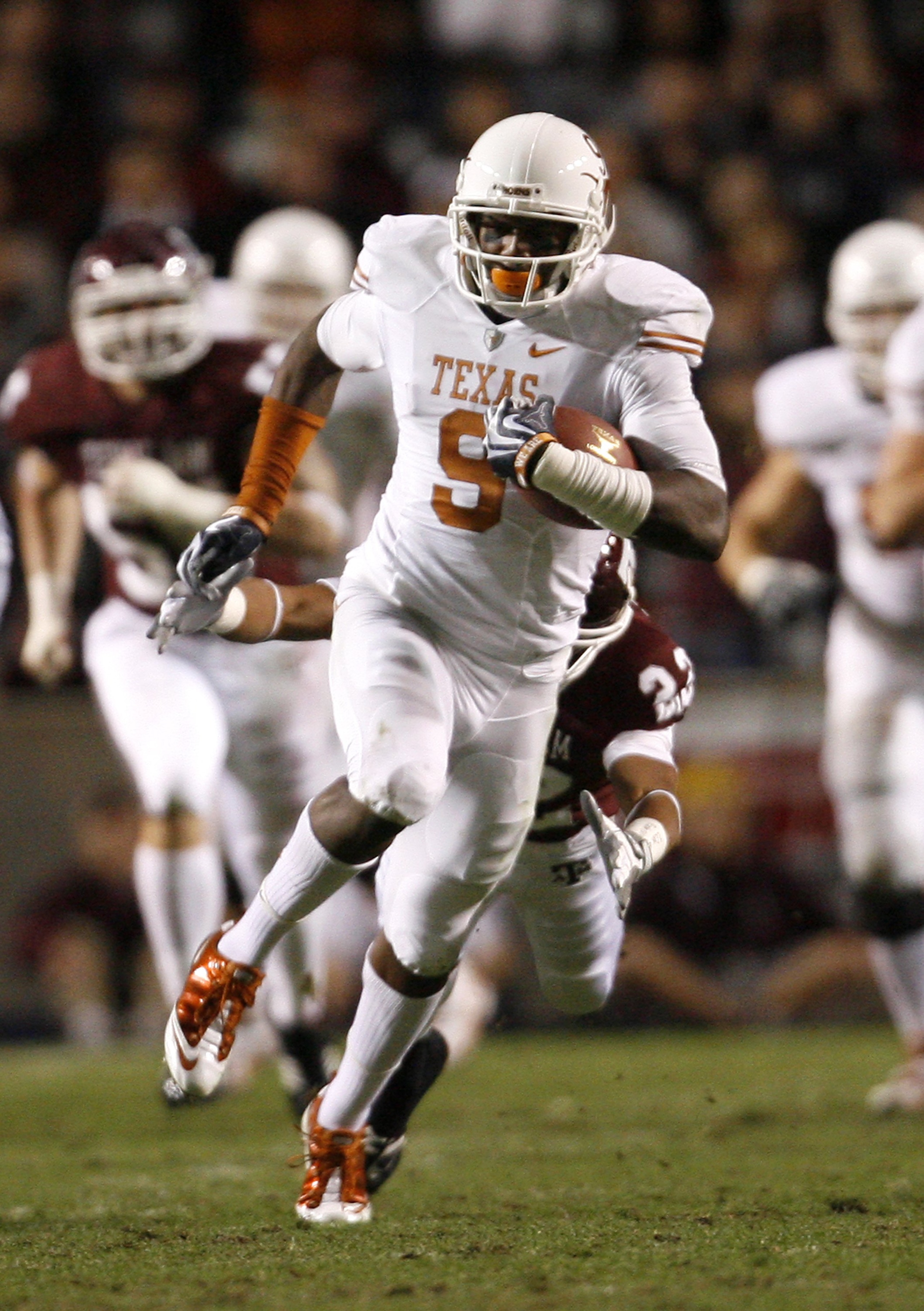 COLLEGE STATION, TX - NOVEMBER 26: Wide receiver Malcolm Williams #9 of the Texas Longhorns runs for a gain after making a reception against the Texas A&M Aggies in the first half at Kyle Field on November 26, 2009 in College Station, Texas. The Longhorn COLLEGE STATION, TX - NOVEMBER 26: Wide receiver Malcolm Williams #9 of the Texas Longhorns runs for a gain after making a reception against the Texas A&M Aggies in the first half at Kyle Field on November 26, 2009 in College Station, Texas. The Longhorn