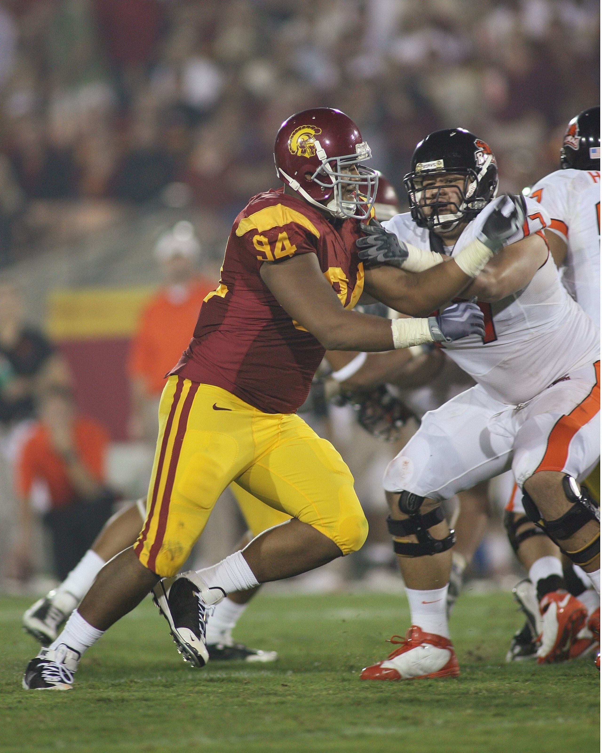LOS ANGELES, CA - OCTOBER 24: Armond Armstead #94 of the USC Trojans rushes against Michael Philipp #77 of the Oregon State Beavers on October 24, 2009 at the Los Angeles Coliseum in Los Angeles, California. USC won 42-36. (Photo by Jeff Golden/Getty I LOS ANGELES, CA - OCTOBER 24: Armond Armstead #94 of the USC Trojans rushes against Michael Philipp #77 of the Oregon State Beavers on October 24, 2009 at the Los Angeles Coliseum in Los Angeles, California. USC won 42-36. (Photo by Jeff Golden/Getty I