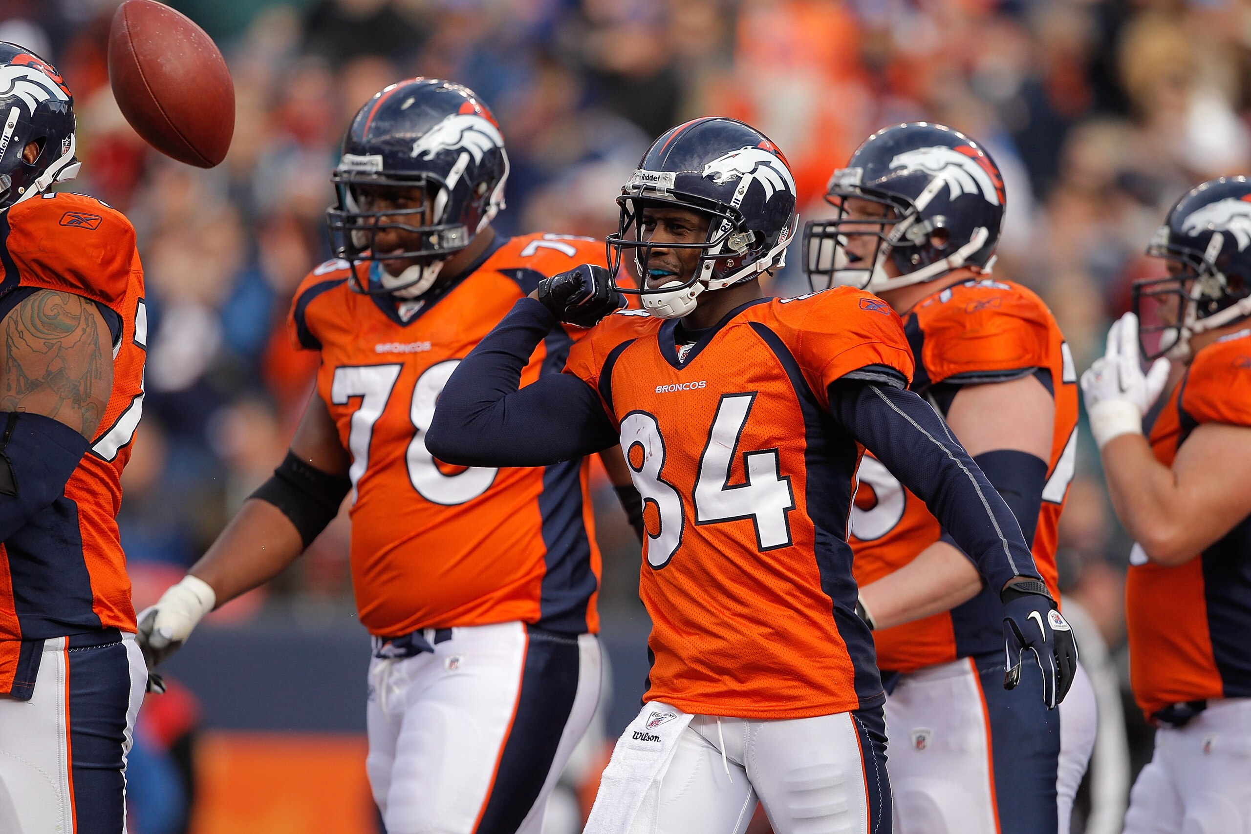DENVER - NOVEMBER 14: Wide receiver Brandon Lloyd #84 of the Denver Broncos celebrates 6-yard touchdown reception with teammates against the Kansas City Chiefs during the first quarter at INVESCO Field at Mile High on November 14, 2010 in Denver, Colorad DENVER - NOVEMBER 14: Wide receiver Brandon Lloyd #84 of the Denver Broncos celebrates 6-yard touchdown reception with teammates against the Kansas City Chiefs during the first quarter at INVESCO Field at Mile High on November 14, 2010 in Denver, Colorad