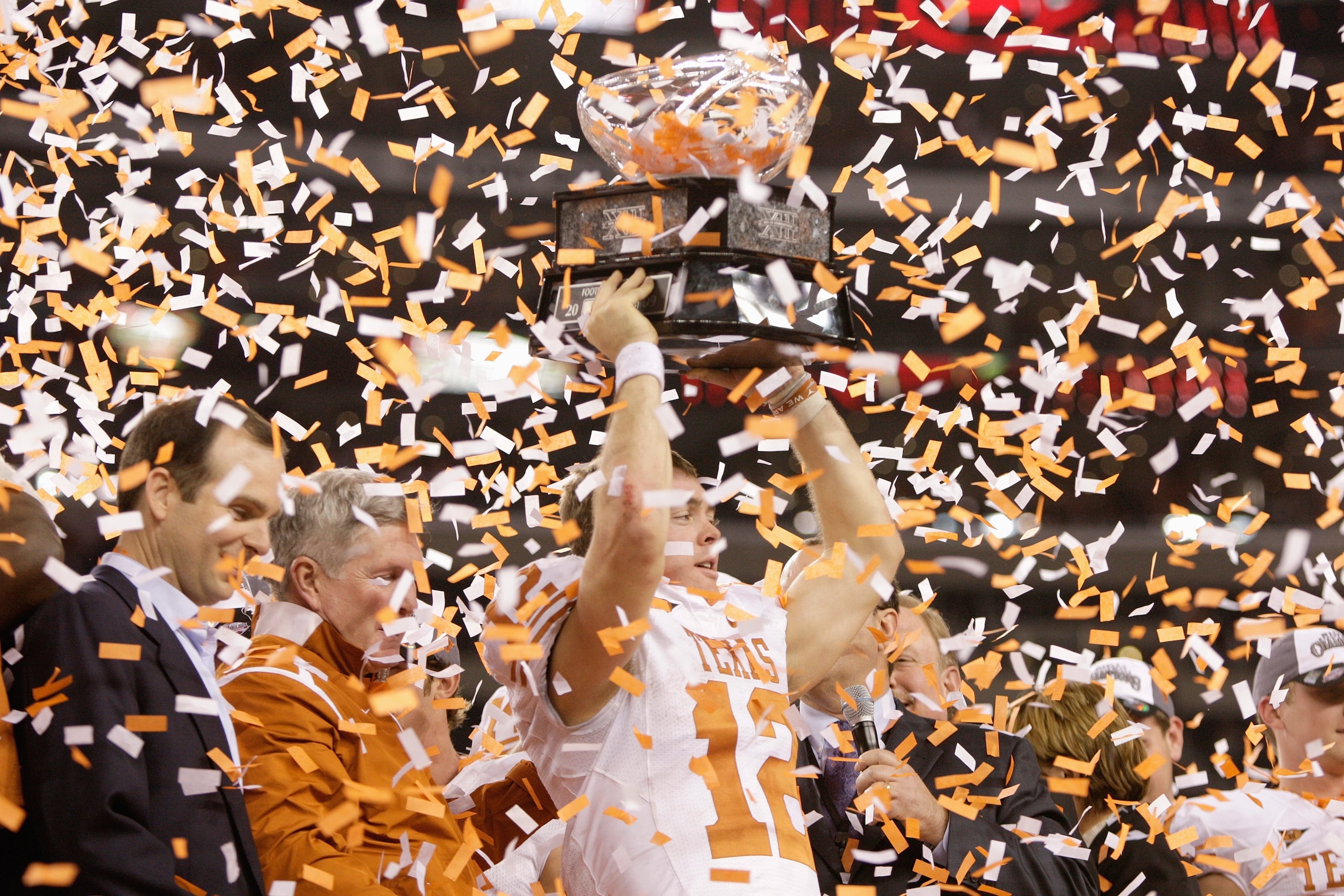 ARLINGTON, TX - DECEMBER 5: Colt McCoy #12 of the Texas Longhorns lifts the trophy after winning the Big 12 Football Championship game against the Nebraska Cornhuskers at Cowboys Stadium on December 5, 2009 in Arlington, Texas. (Photo by Jamie Squire/Gett ARLINGTON, TX - DECEMBER 5: Colt McCoy #12 of the Texas Longhorns lifts the trophy after winning the Big 12 Football Championship game against the Nebraska Cornhuskers at Cowboys Stadium on December 5, 2009 in Arlington, Texas. (Photo by Jamie Squire/Gett