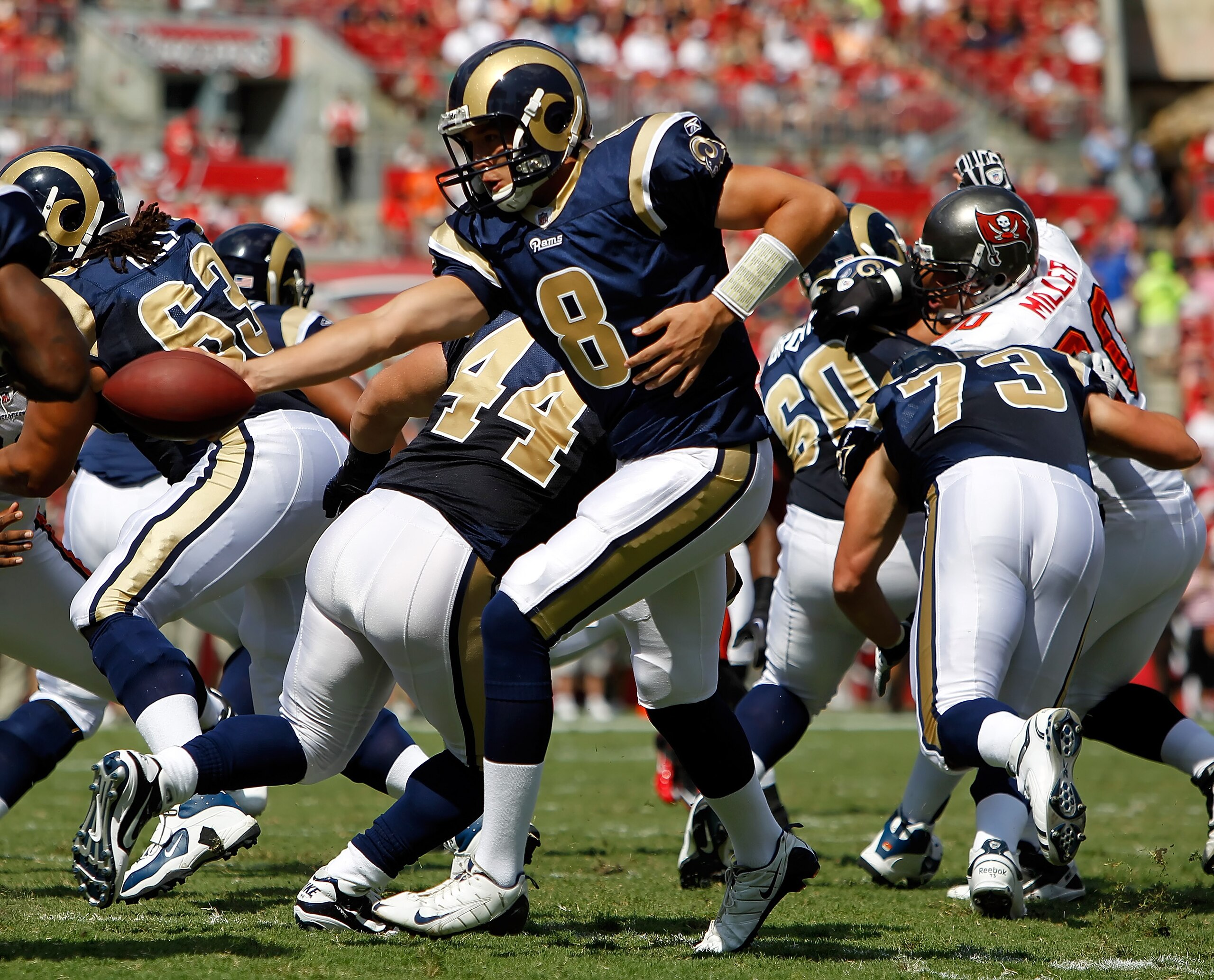 TAMPA, FL - OCTOBER 24: Quarterback Sam Bradford #8 of the St. Louis Rams hands the ball off against the Tampa Bay Buccaneers during the game at Raymond James Stadium on October 24, 2010 in Tampa, Florida. (Photo by J. Meric/Getty Images) TAMPA, FL - OCTOBER 24: Quarterback Sam Bradford #8 of the St. Louis Rams hands the ball off against the Tampa Bay Buccaneers during the game at Raymond James Stadium on October 24, 2010 in Tampa, Florida. (Photo by J. Meric/Getty Images)