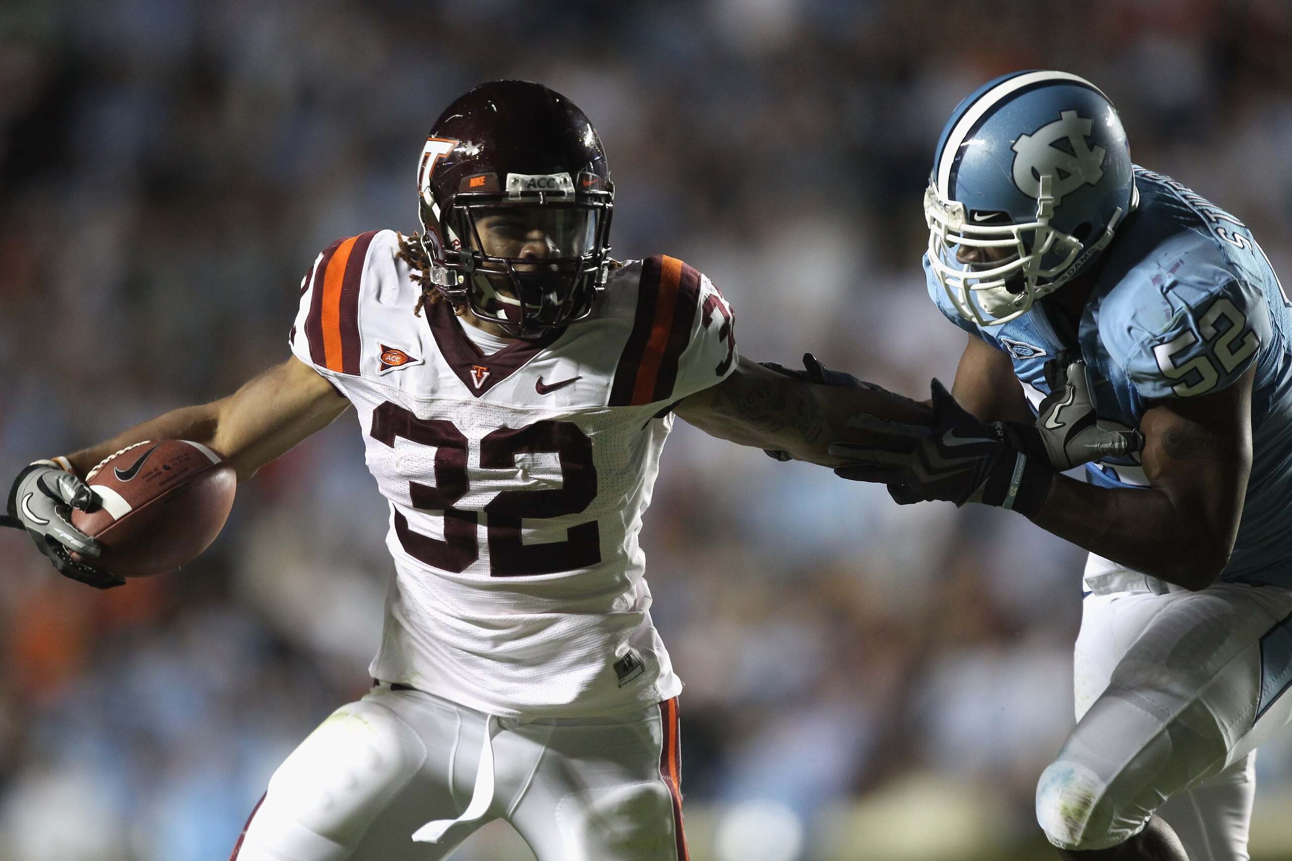 CHAPEL HILL, NC - NOVEMBER 13: Darren Evans #32 of the Virginia Tech Hokies is tackled by Quan Sturdivant #52 of the North Carolina Tar Heels during their game at Kenan Stadium on November 13, 2010 in Chapel Hill, North Carolina. (Photo by Streeter Leck CHAPEL HILL, NC - NOVEMBER 13: Darren Evans #32 of the Virginia Tech Hokies is tackled by Quan Sturdivant #52 of the North Carolina Tar Heels during their game at Kenan Stadium on November 13, 2010 in Chapel Hill, North Carolina. (Photo by Streeter Leck