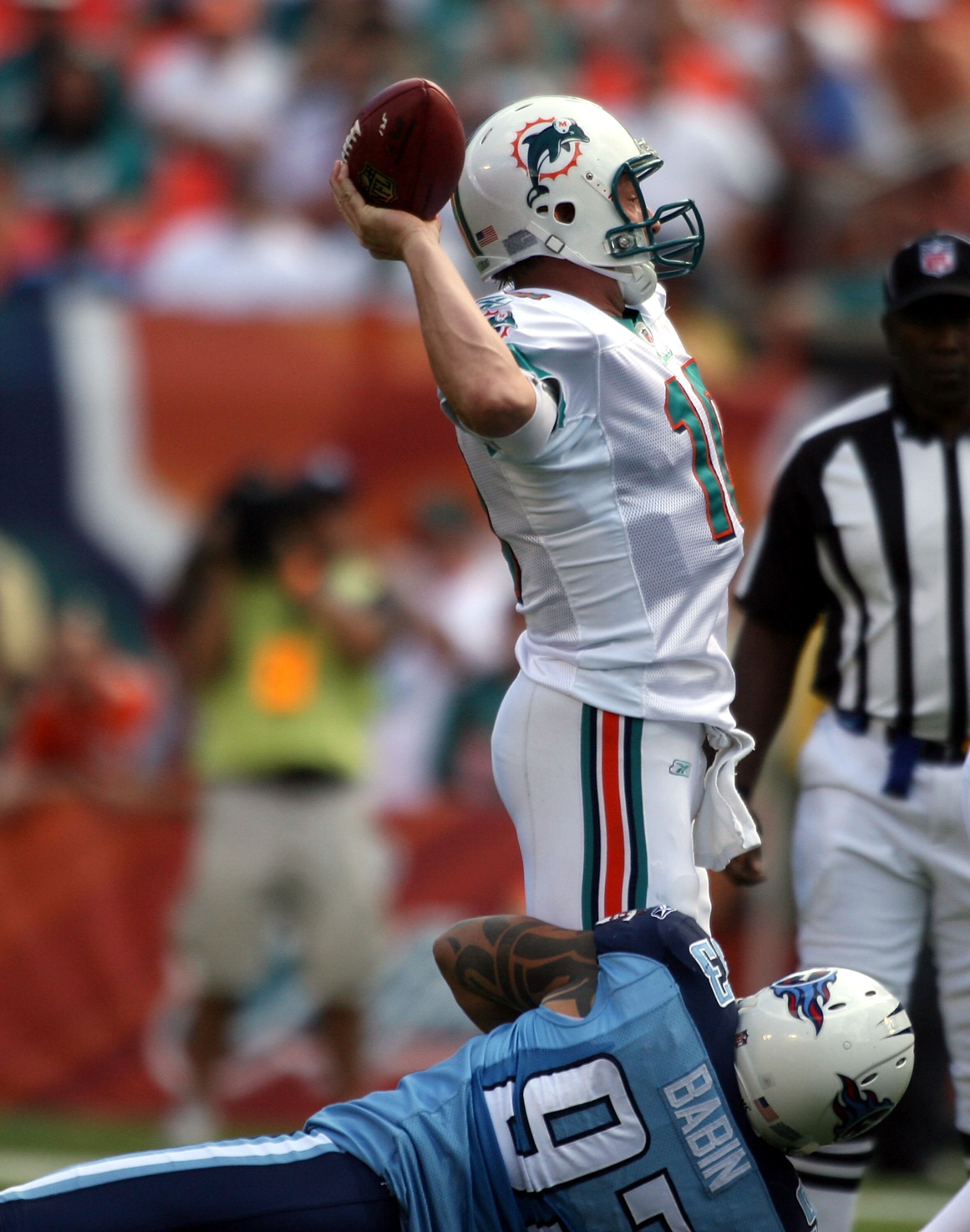 MIAMI - NOVEMBER 14:  Quarterback Chad Pennington #10 of the Miami Dolphins is hit against the Tennessee Titans at Sun Life Stadium on November 14, 2010 in Miami, Florida.  (Photo by Marc Serota/Getty Images)