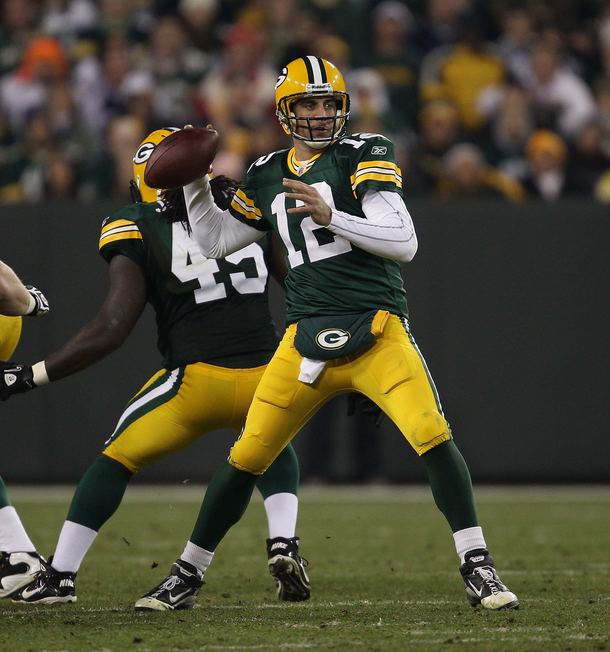 GREEN BAY, WI - NOVEMBER 07: Aaron Rodgers #12 of the Green Bay Packers throws a pass against the Dallas Cowboys at Lambeau Field on November 7, 2010 in Green Bay, Wisconsin. The Packers defeated the Cowboys 45-7. (Photo by Jonathan Daniel/Getty Images)