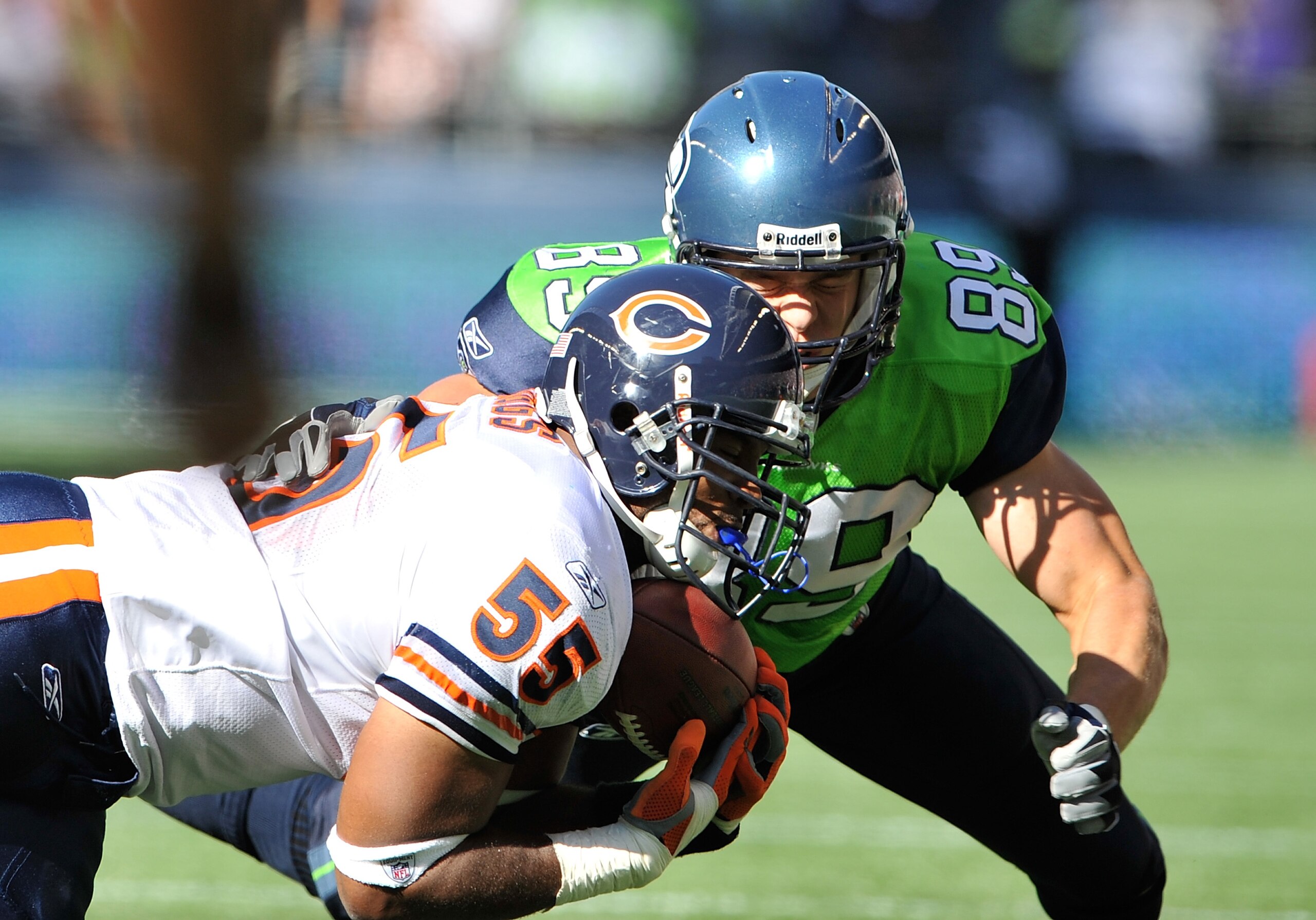 SEATTLE - SEPTEMBER 27:  Linebacker Lance Briggs #55 of the Chicago Bears makes an interception against  John Carlson #89 of the Seattle Seahawks on September 27, 2009 at Qwest Field in Seattle, Washington. The Bears defeated the Seahawks 25-19. (Photo by