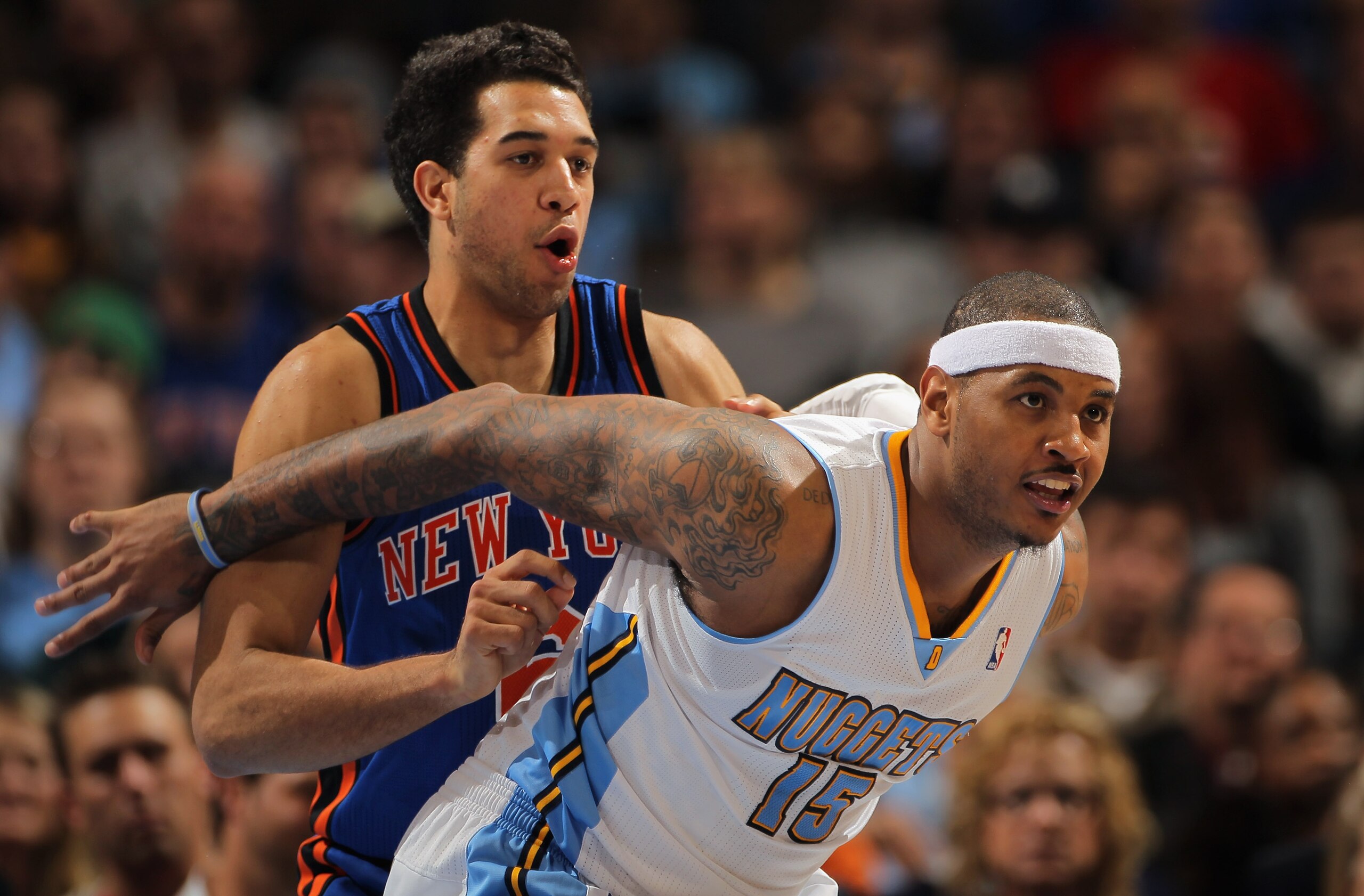 DENVER - NOVEMBER 16: Carmelo Anthony #15 of the Denver Nuggets fights for position with Landry Fields #6 of the New York Knicks at the Pepsi Center on November 16, 2010 in Denver, Colorado. NOTE TO USER: User expressly acknowledges and agrees that, by d DENVER - NOVEMBER 16: Carmelo Anthony #15 of the Denver Nuggets fights for position with Landry Fields #6 of the New York Knicks at the Pepsi Center on November 16, 2010 in Denver, Colorado. NOTE TO USER: User expressly acknowledges and agrees that, by d