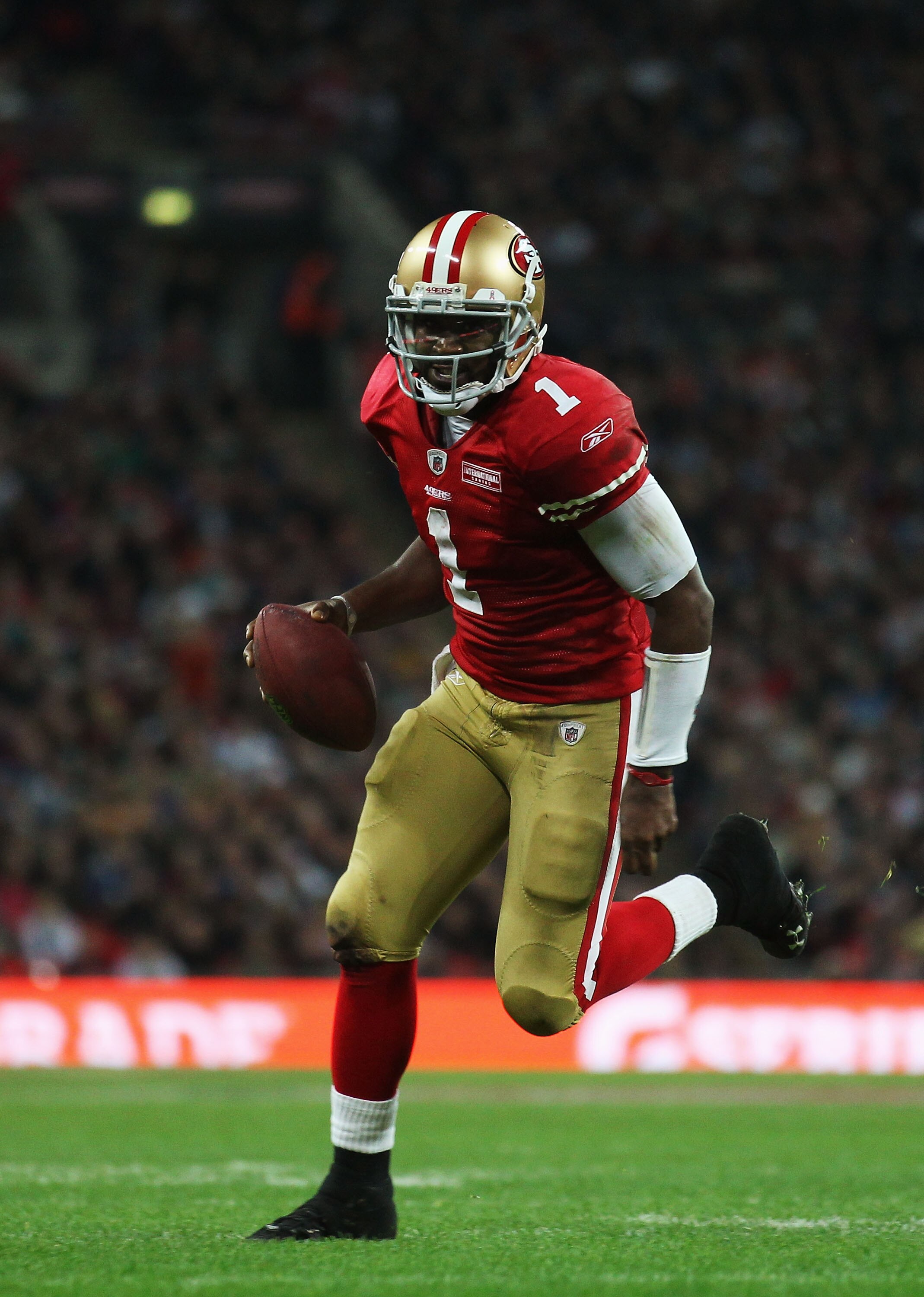 LONDON, ENGLAND - OCTOBER 31:  Troy Smith #1 of San Francisco 49ers scores their first touchdown during the NFL International Series match between Denver Broncos and San Francisco 49ers at Wembley Stadium on October 31, 2010 in London, England. This is th