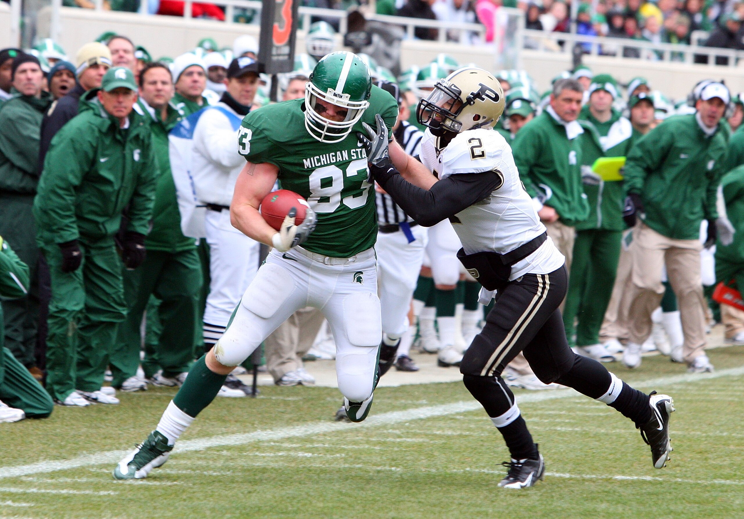 EAST LANSING, MI - NOVEMBER 08: Charlie Gantt #83 of the Michigan State Spartans runs the ball against Torri Williams #2 of the Purdue Boilermakers at Spartan Stadium on November 8, 2008 in East Lansing, Michigan. (Photo by Jim McIsaac/Getty Images) EAST LANSING, MI - NOVEMBER 08: Charlie Gantt #83 of the Michigan State Spartans runs the ball against Torri Williams #2 of the Purdue Boilermakers at Spartan Stadium on November 8, 2008 in East Lansing, Michigan. (Photo by Jim McIsaac/Getty Images)