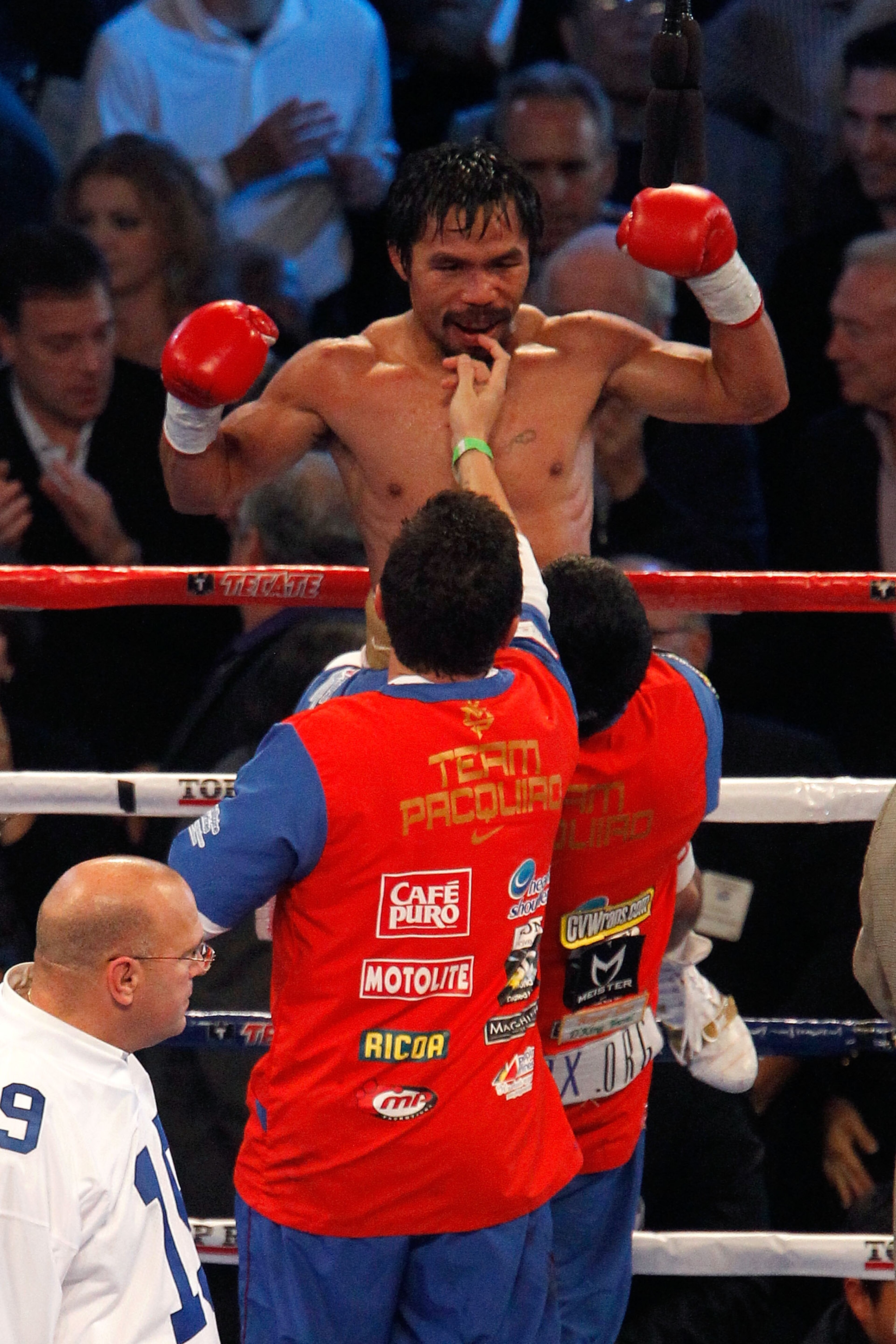 ARLINGTON, TX - NOVEMBER 13:  Manny Pacquiao (white trunks) of the Philippines celebrates after he was declared the winner by a unanimous decision against Antonio Margarito (black trunks) of Mexico during their WBC World Super Welterweight Title bout at C