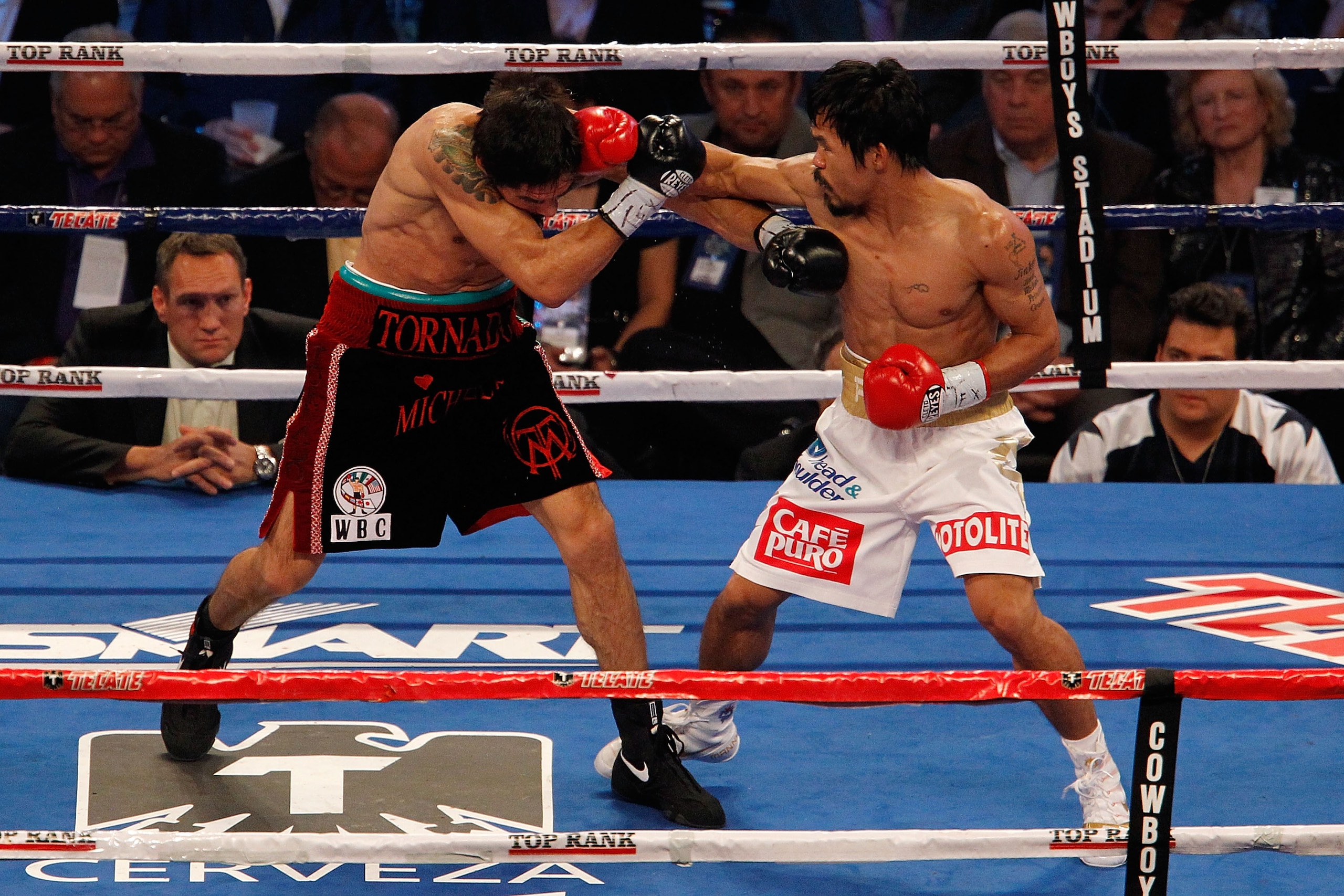 ARLINGTON, TX - NOVEMBER 13: Manny Pacquiao (white trunks) of the Philippines lands a punch against Antonio Margarito (black trunks) of Mexico during their WBC World Super Welterweight Title bout at Cowboys Stadium on November 13, 2010 in Arlington, Texa ARLINGTON, TX - NOVEMBER 13: Manny Pacquiao (white trunks) of the Philippines lands a punch against Antonio Margarito (black trunks) of Mexico during their WBC World Super Welterweight Title bout at Cowboys Stadium on November 13, 2010 in Arlington, Texa