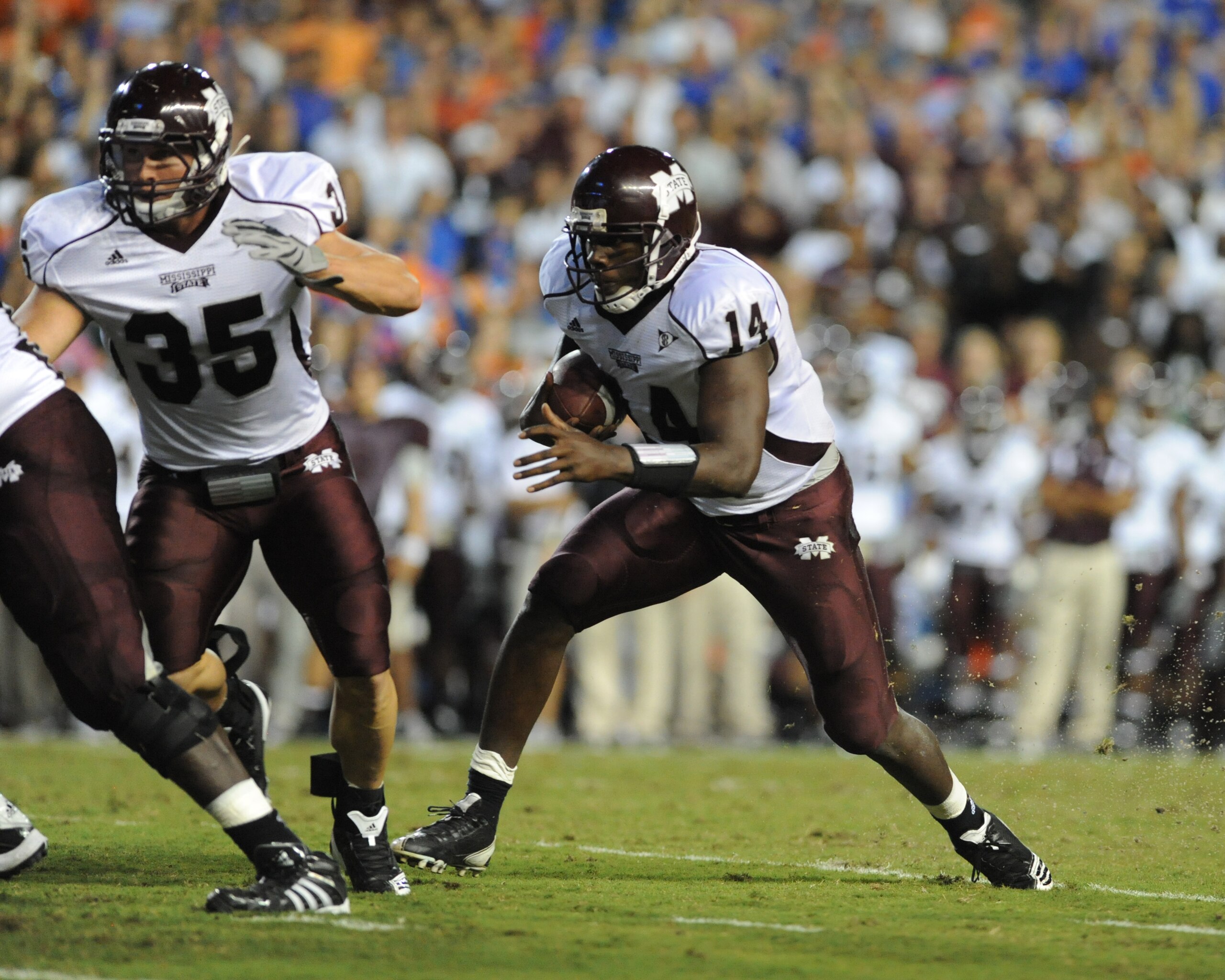 GAINESVILLE, FL - OCTOBER 16:  Quarterback Chris Relf #14 of the Mississippi State Bulldogs runs for a touchdown against the Florida Gators October 16, 2010 Ben Hill Griffin Stadium at Gainesville, Florida.  (Photo by Al Messerschmidt/Getty Images)