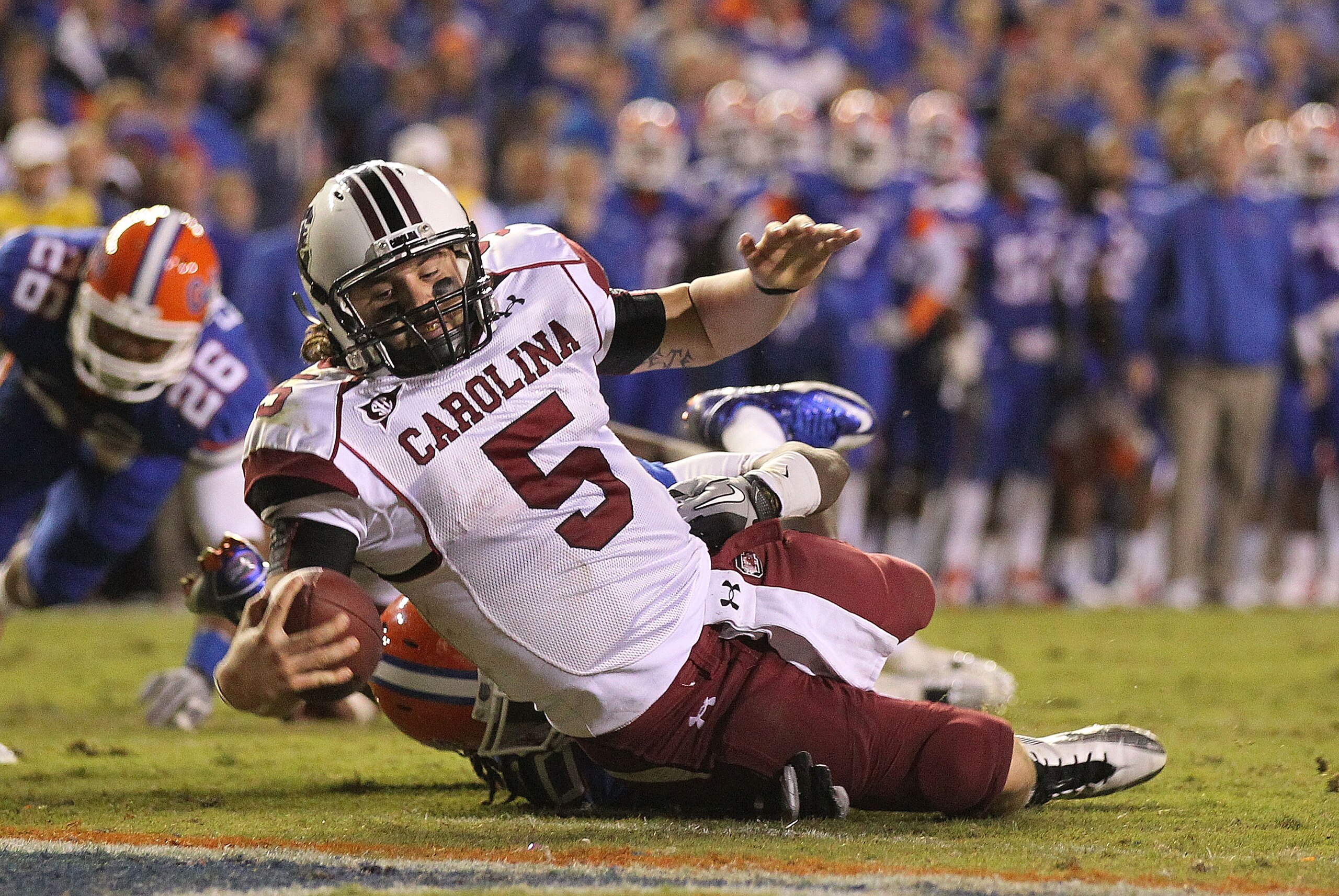 GAINESVILLE, FL - NOVEMBER 13:  Stephen Garcia #5 of the South Carolina Gamecocks rushes for a touchdown during a game against the Florida Gators at Ben Hill Griffin Stadium on November 13, 2010 in Gainesville, Florida. The Gamecocks beat the Gators 36-14