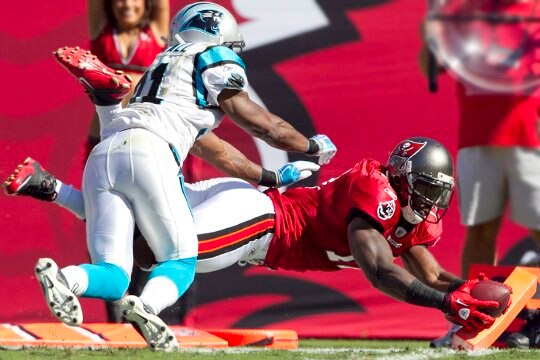 Arrelious Benn dives for the pylon and scores against Carolina.