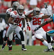 Ronde Barber leads the way for Aqib Talib after an interception