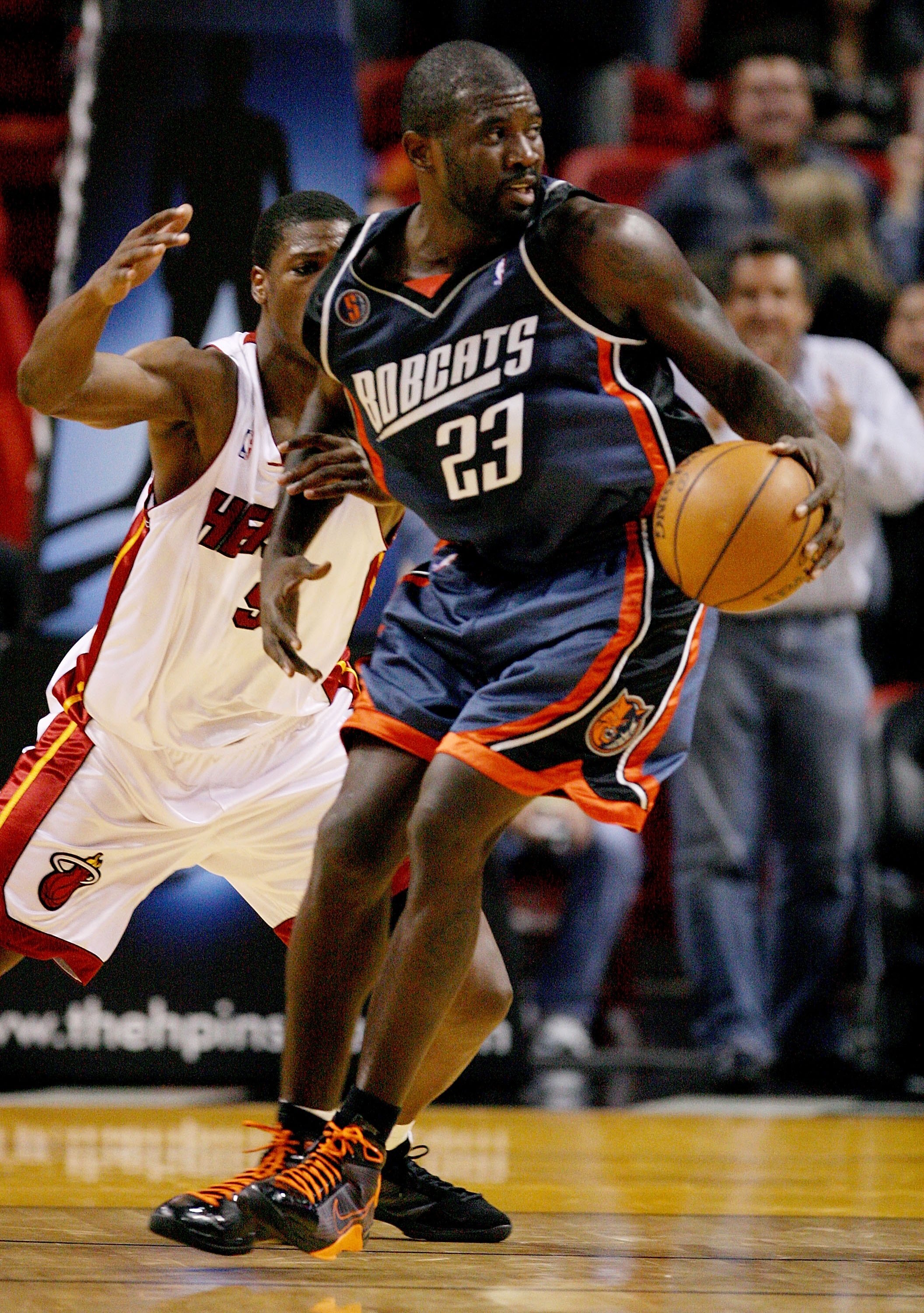 MIAMI - DECEMBER 08:  Jason Richardson #23 of the Charlotte Bobcats spins against Yakhouba Diawara #9 of the Miami Heat at American Airlines Arena on December 8, 2008 in Miami, Florida. The Heat defeated the Bobcats 100-96. NOTE TO USER: User expressly ac