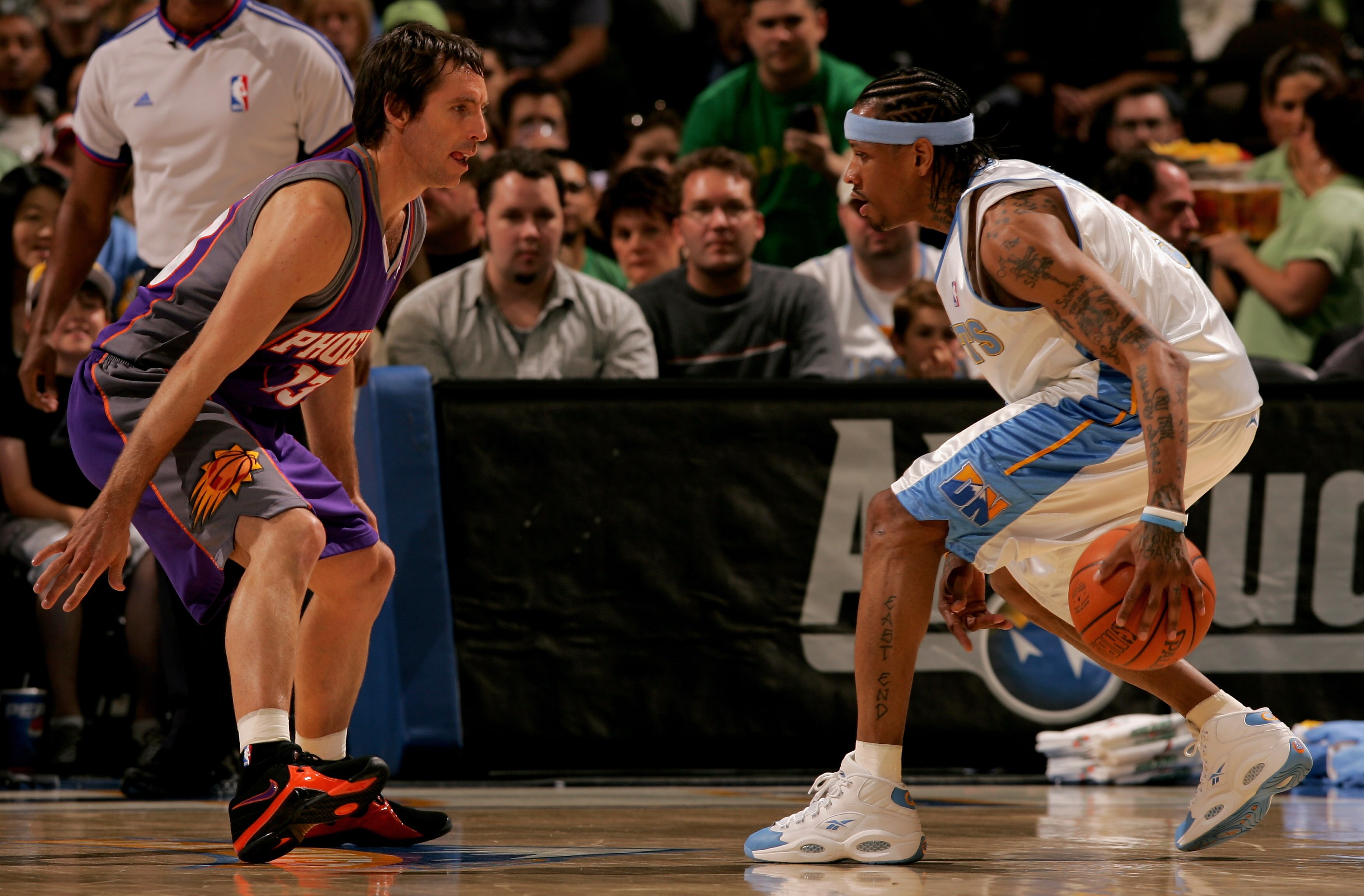 DENVER - MARCH 17:   Allen Iverson #3 of the Denver Nuggets controls the ball as Steve Nash #13 of the Phoenix Suns defends during NBA action at the Pepsi Center on March 17, 2007 in Denver, Colorado. NOTE TO USER: User expressly acknowledges and agrees t