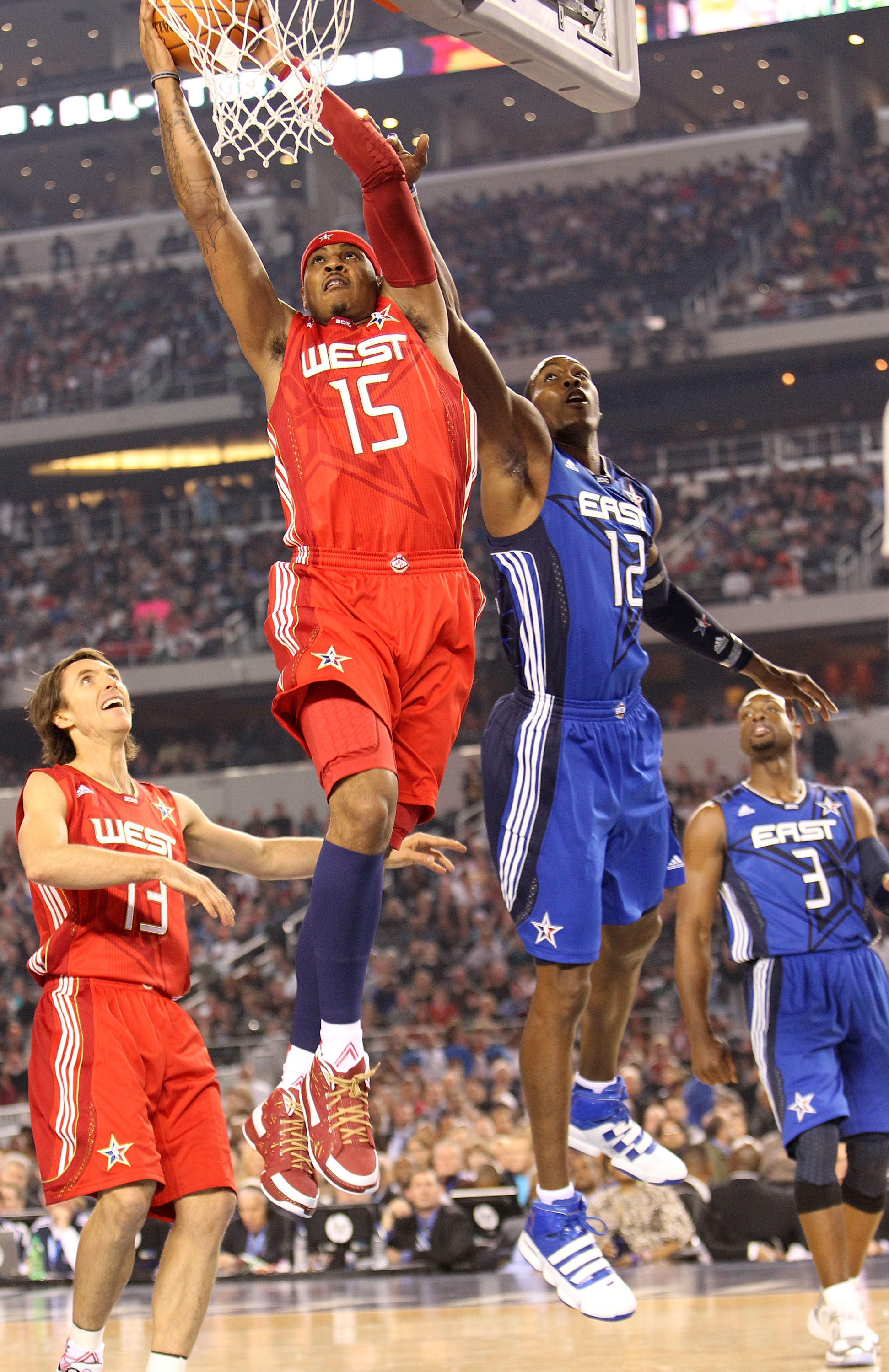 ARLINGTON, TX - FEBRUARY 14:  Carmelo Anthony #15 of the Western Conference shoots against Dwight Howard #12 of the Eastern Conference during the first quarter of the NBA All-Star Game, part of 2010 NBA All-Star Weekend at Cowboys Stadium on February 14,