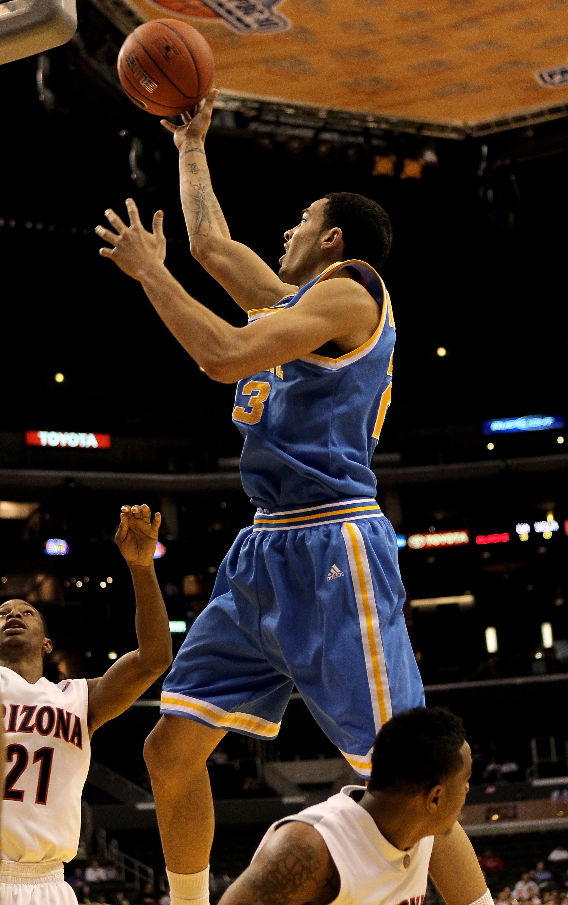 LOS ANGELES, CA - MARCH 11:  Tyler Honeycutt #23 of the UCLA Bruins shoots against the Arizona Wildcats during the quarterfinals of the Pac-10 Basketball Tournament at Staples Center on March 11, 2010 in Los Angeles, California. UCLA won 75-69.  (Photo by