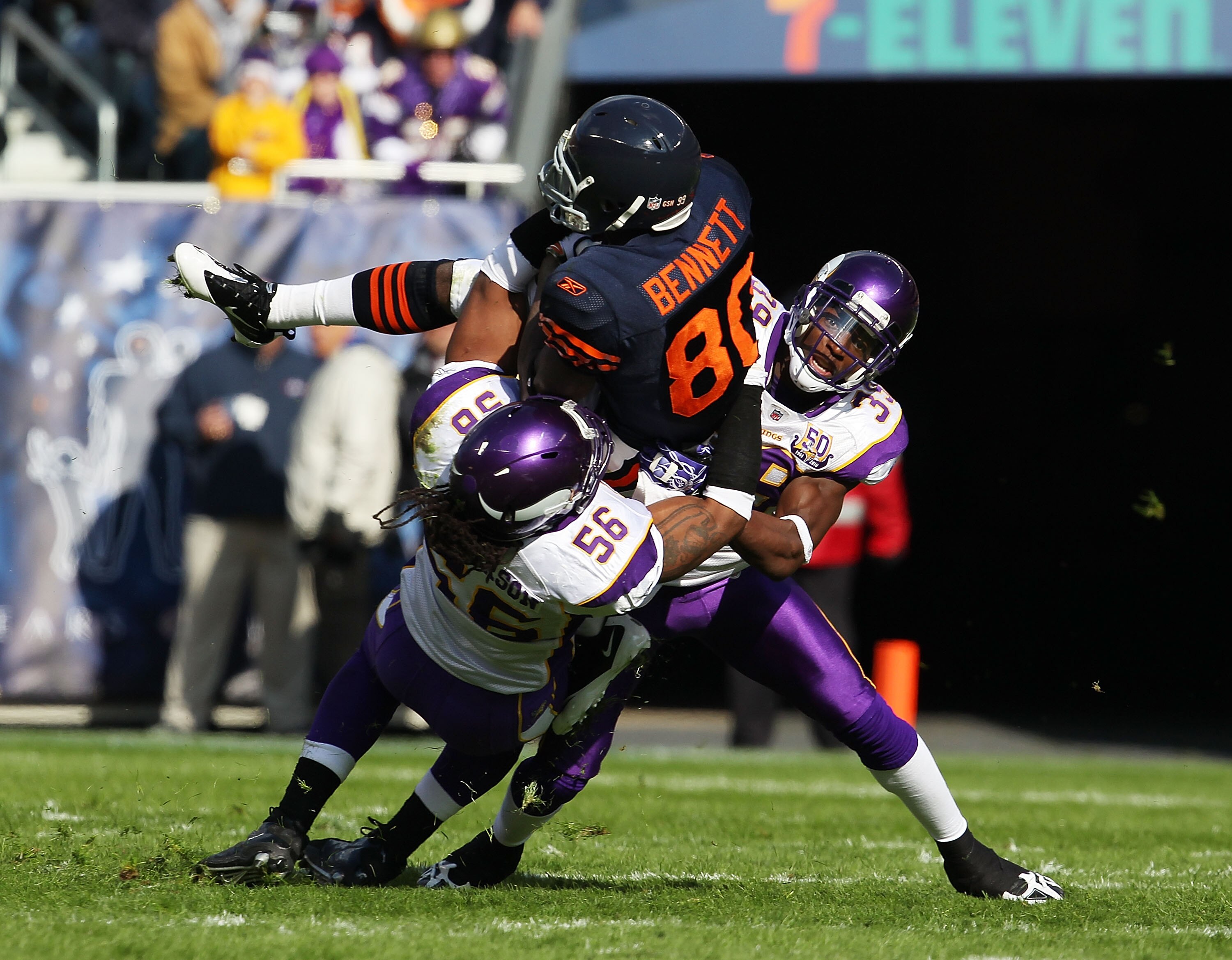 CHICAGO - NOVEMBER 14: E.J. Henderson #56 and Husain Abdullah #39 of the Minnesota Vikings tackle Earl Bennett #80 of the Chicago Bears at Soldier Field on November 14, 2010 in Chicago, Illinois. The Bears defeated the Vikings 27-13. (Photo by Jonathan Da