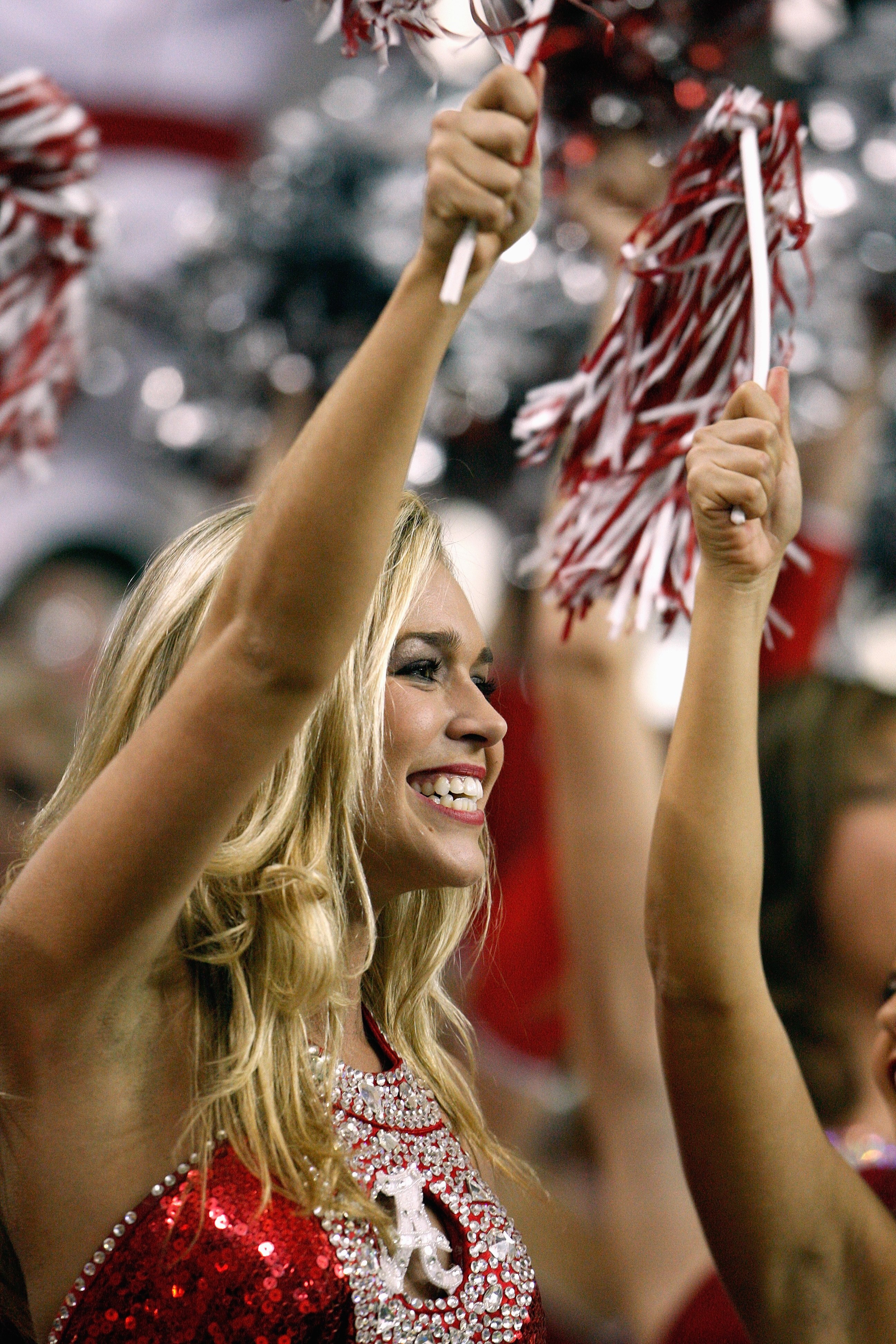 ATLANTA - DECEMBER 06:  A cheerleader of the Alabama Crimson Tide cheers against the Florida Gators during the SEC Championship on December 6, 2008 at the Georgia Dome in Atlanta, Georgia.  (Photo by Kevin C. Cox/Getty Images)