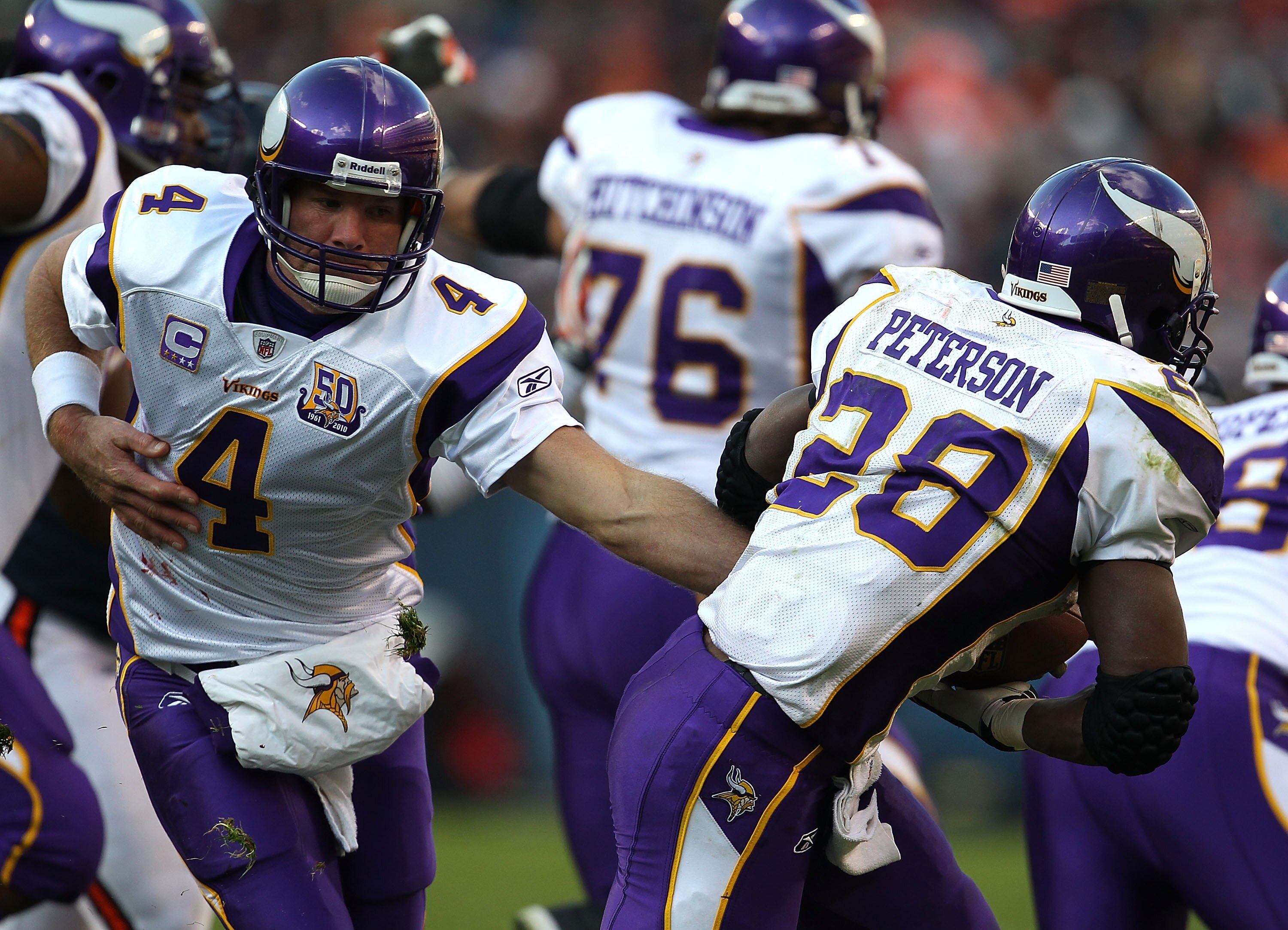 CHICAGO - NOVEMBER 14: Brett Favre #4 of the Minnesota Vikings hands off to Adrian Peterson #28 against the Chicago Bears at Soldier Field on November 14, 2010 in Chicago, Illinois. The Bears defeated the Vikings 27-13. (Photo by Jonathan Daniel/Getty Ima