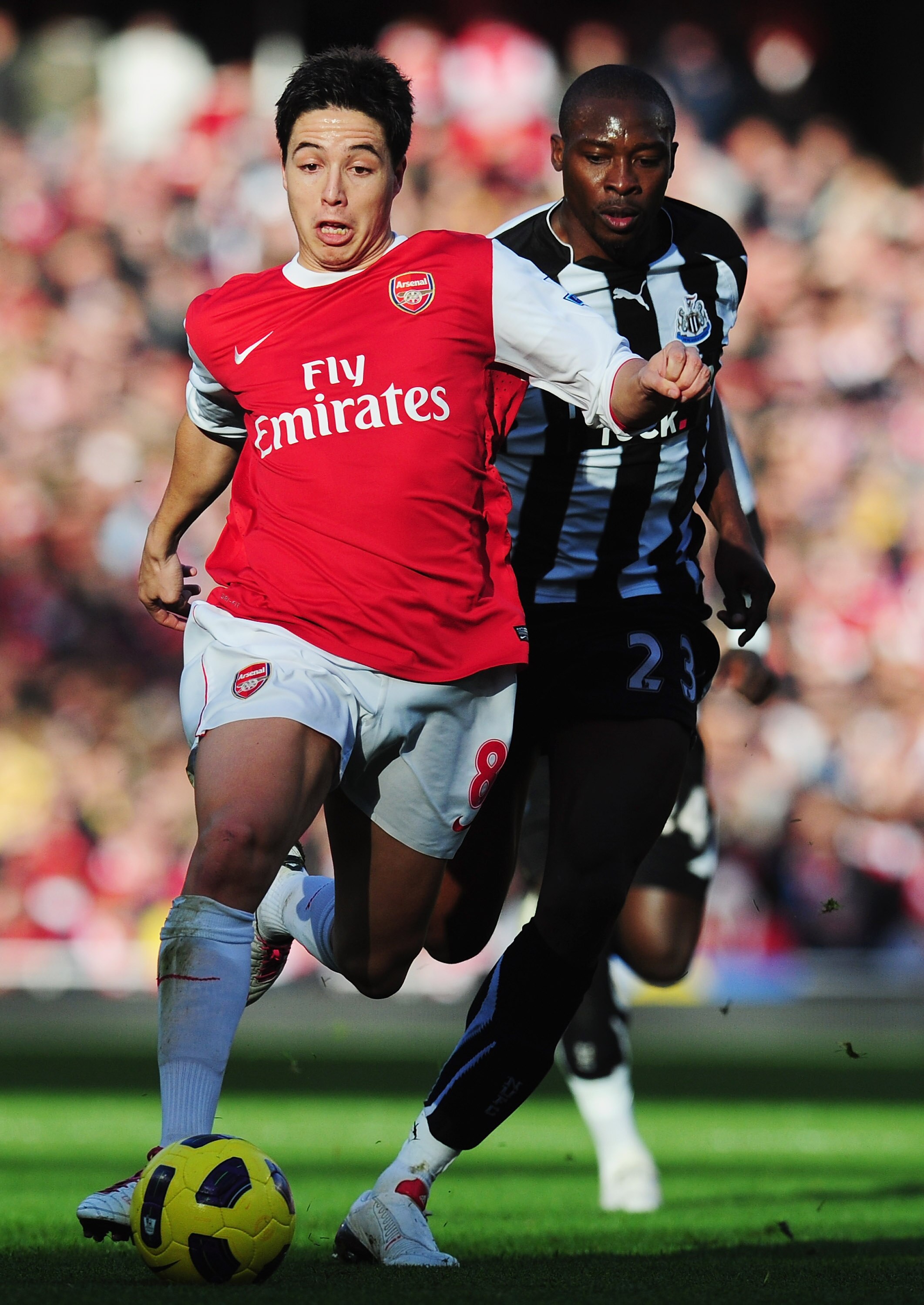 LONDON, ENGLAND - NOVEMBER 07:  Samir Nasri of Arsenal is chased by Shola Ameobi of Newcastle during the Barclays Premier League match between Arsenal and Newcastle United at the Emirates Stadium on November 7, 2010 in London, England.  (Photo by Mike Hew