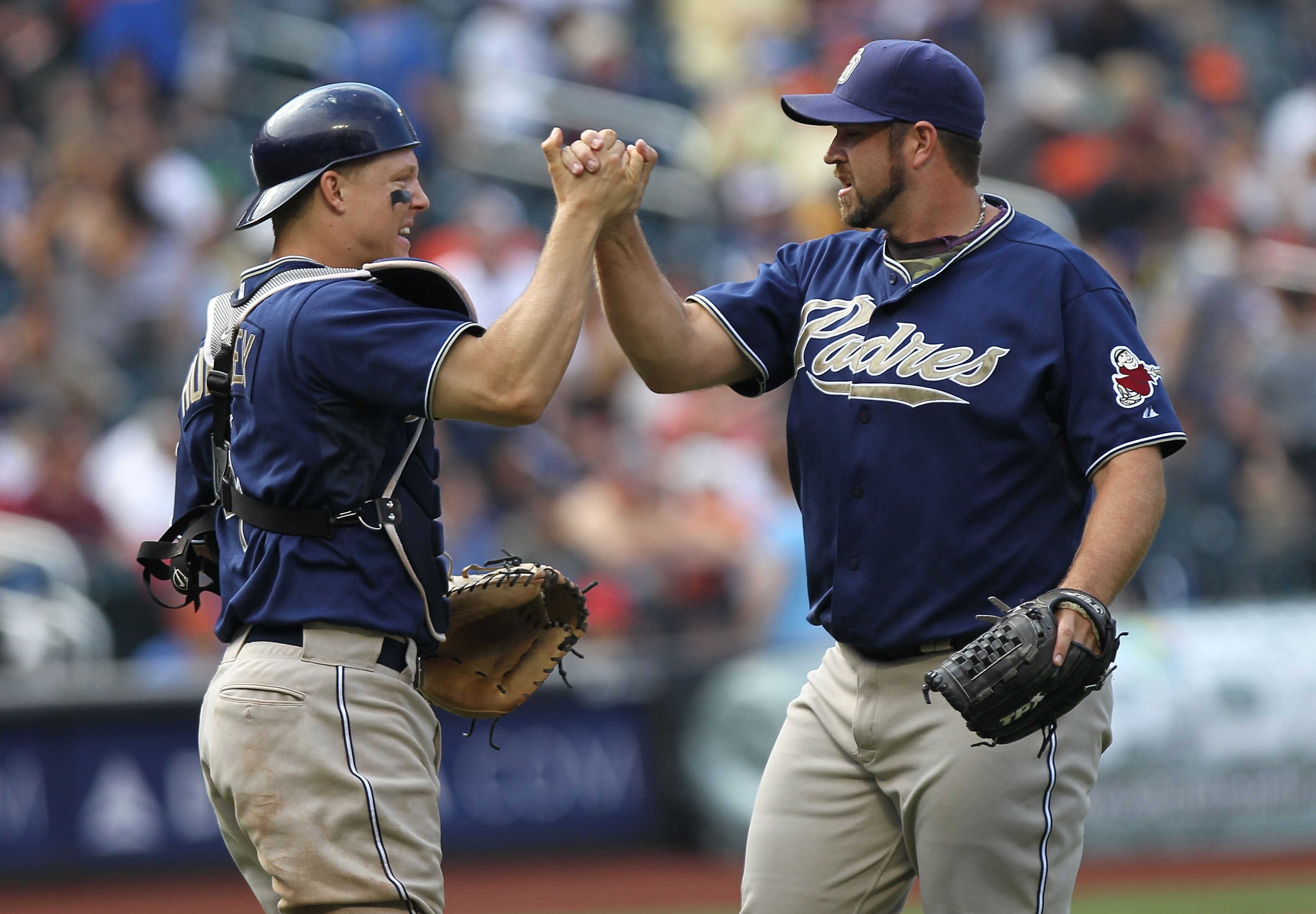 NEW YORK - JUNE 10:  Heath Bell #21 of the San Diego Padres celebrates the win with catcher Nick Hundley #4 against the New York Mets at Citi Field on June 10, 2010 in the Flushing neighborhood of the Queens borough of New York City.  (Photo by Nick Laham