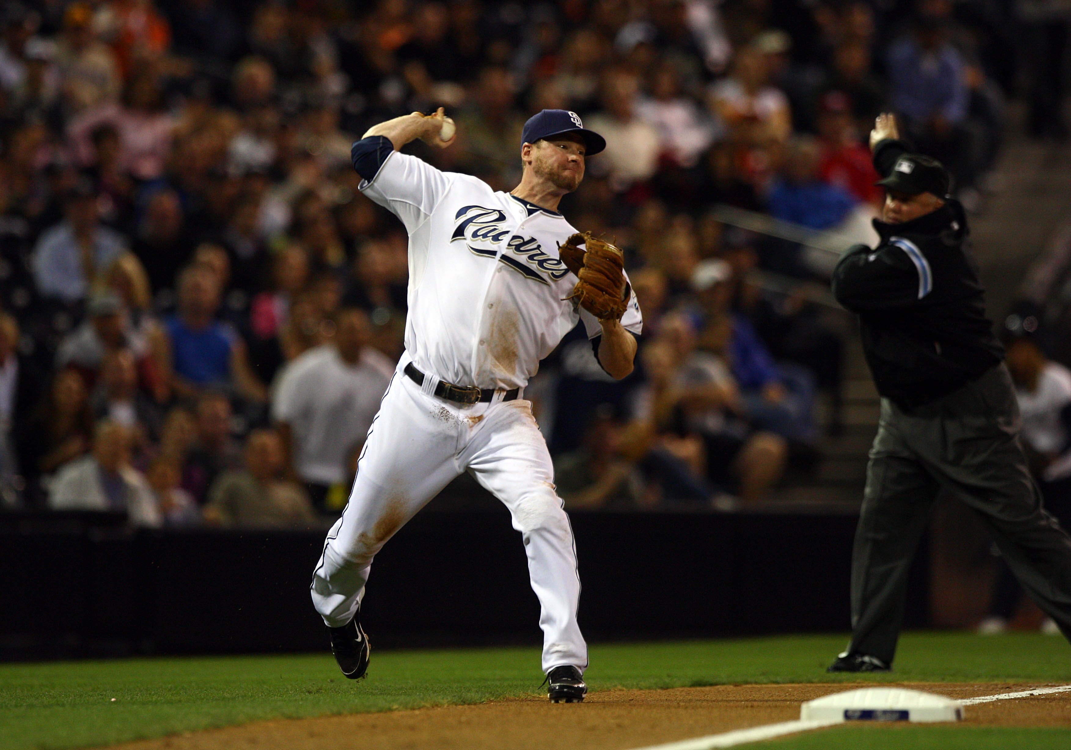SAN DIEGO, CA - SEPTEMBER 10:  3rd Baseman Chase Headley #7 of the San Diego Padres fields the ball for an out against the San Francisco Giants during their MLB game on September 10, 2010 at Petco Park in San Diego, California. (Photo by Donald Miralle/Ge