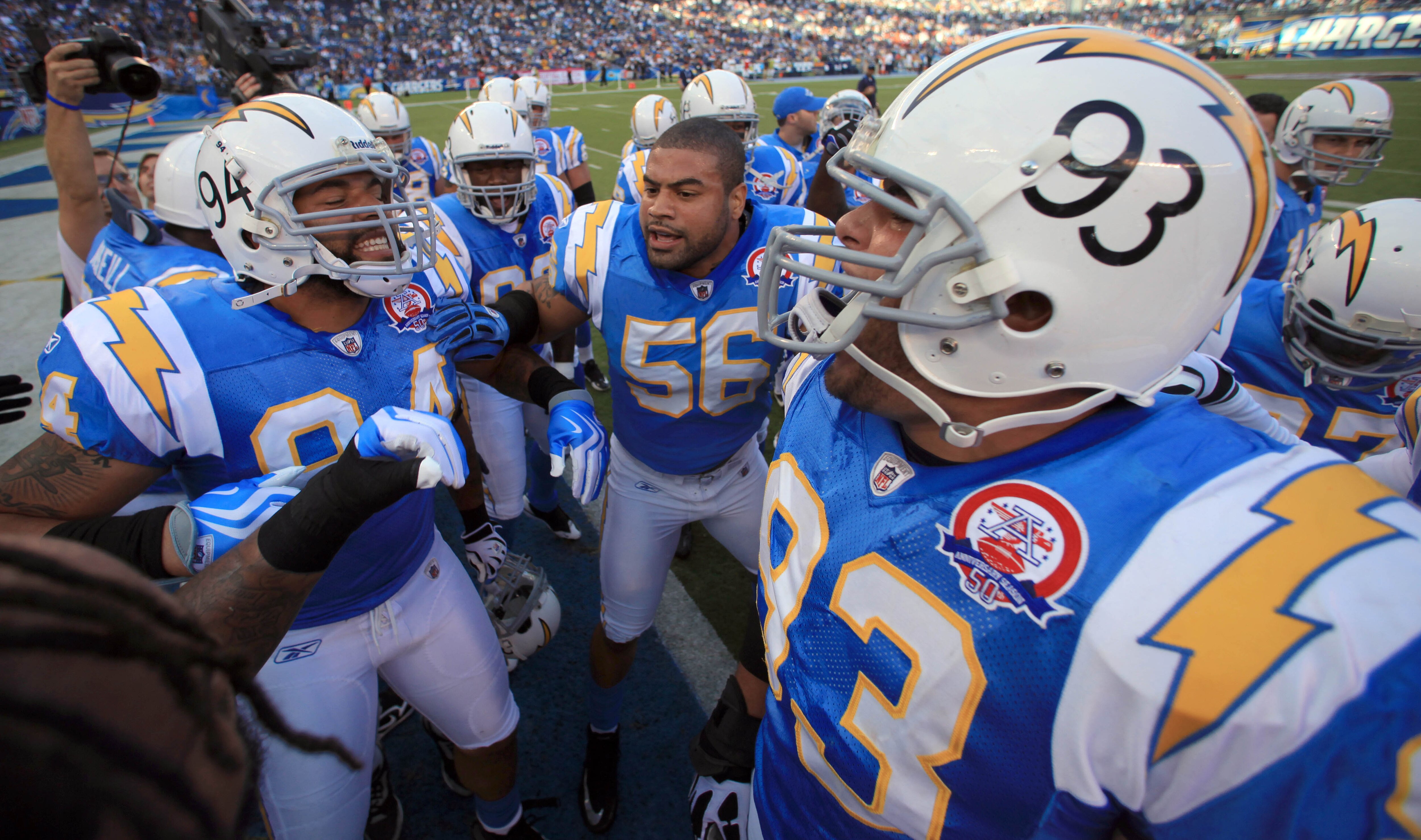 SAN DIEGO, CA - OCTOBER 19:  Linebacker Shawn Merriman #56, Jyles Tucker #94, and Luis Castillo #93 of the San Diego Chargers leads the team in a cheer before the start of the game against the Denver Broncos during Monday Night Football on October 19, 200