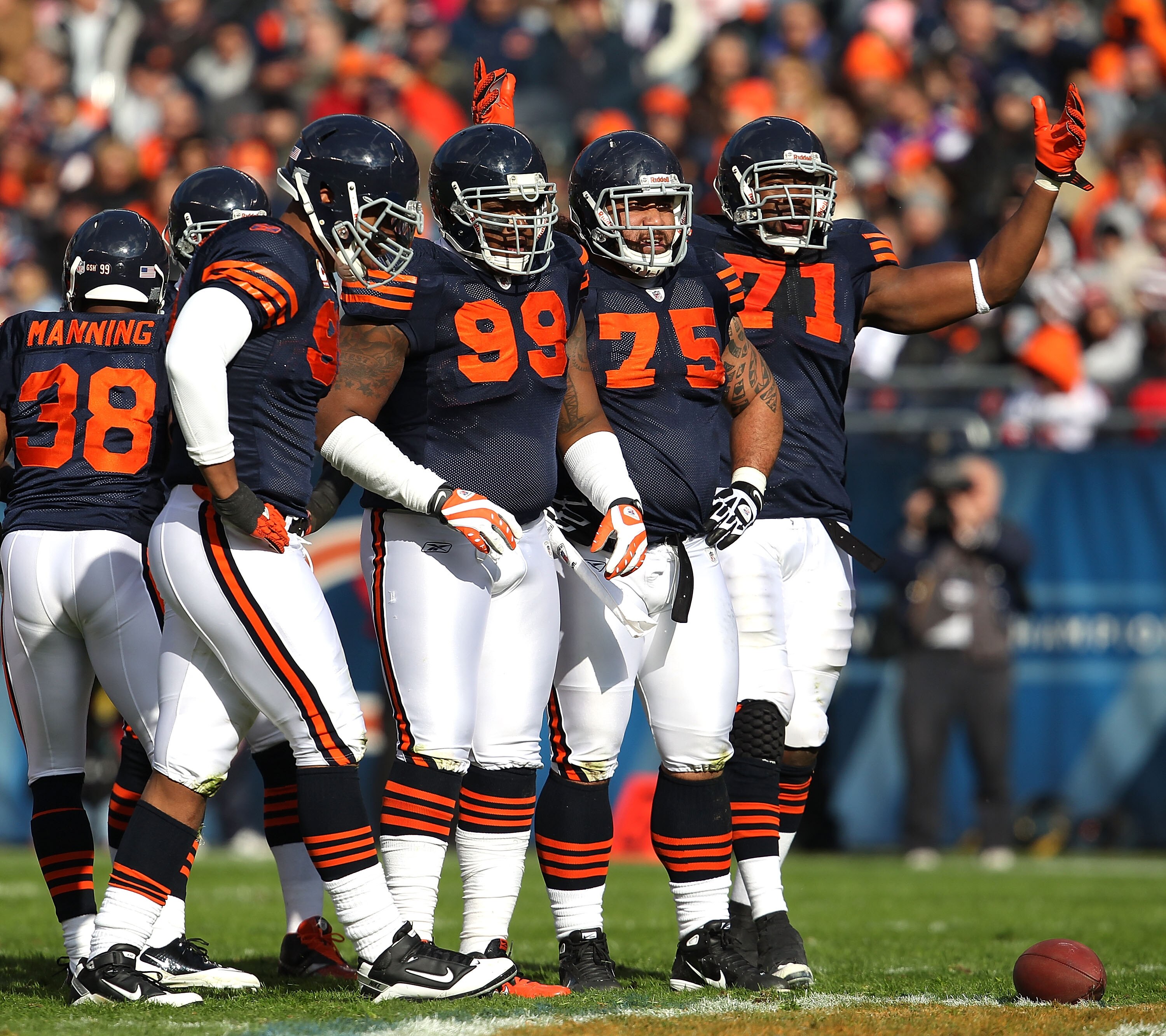CHICAGO - NOVEMBER 14: Members of the Chicago Bear defense including (L-R) Julius Peppers #90, Marcus Harrison #99, Matt Toeaina #75 and Israel Idonije #71 await the start of play against the Minnesota Vikings at Soldier Field on November 14, 2010 in Chic CHICAGO - NOVEMBER 14: Members of the Chicago Bear defense including (L-R) Julius Peppers #90, Marcus Harrison #99, Matt Toeaina #75 and Israel Idonije #71 await the start of play against the Minnesota Vikings at Soldier Field on November 14, 2010 in Chic
