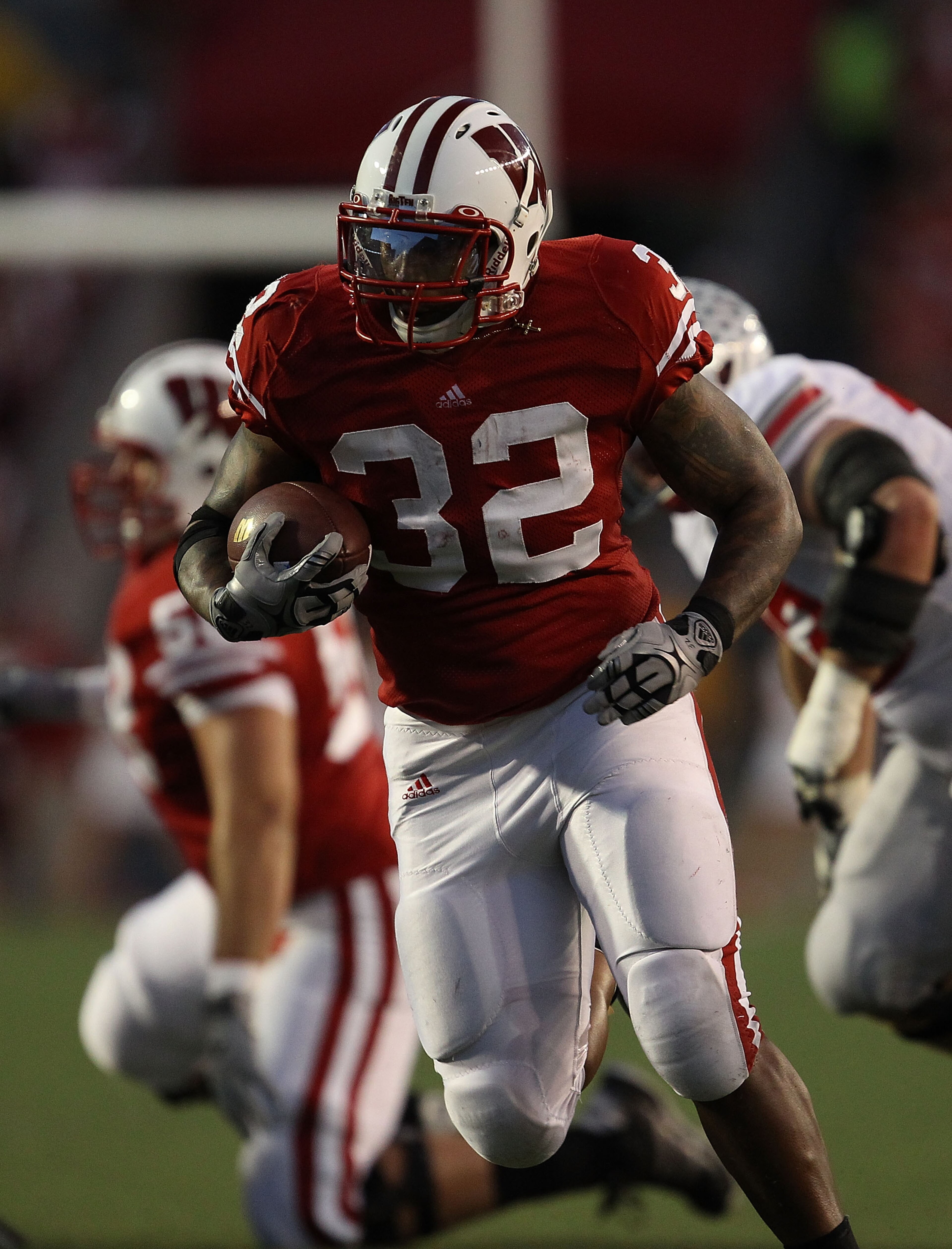 MADISON, WI - OCTOBER 16: John Clay #32 of the Wisconsin Badgers runs against the Ohio State Buckeyes at Camp Randall Stadium on October 16, 2010 in Madison, Wisconsin. Wisconsin defeated Ohio State 31-18. (Photo by Jonathan Daniel/Getty Images) MADISON, WI - OCTOBER 16: John Clay #32 of the Wisconsin Badgers runs against the Ohio State Buckeyes at Camp Randall Stadium on October 16, 2010 in Madison, Wisconsin. Wisconsin defeated Ohio State 31-18. (Photo by Jonathan Daniel/Getty Images)
