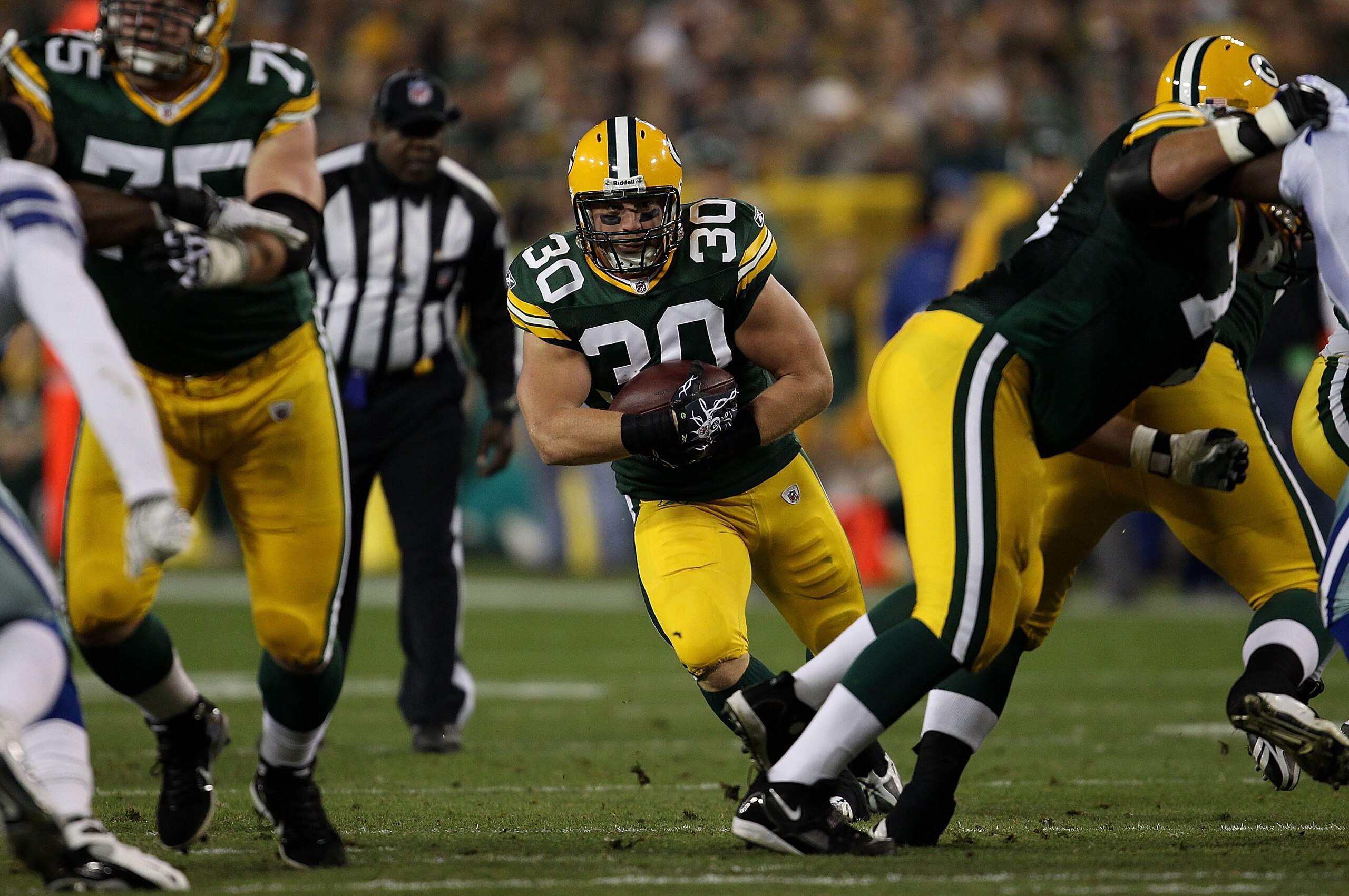 GREEN BAY, WI - NOVEMBER 07: John Kuhn #30 of the Green Bay Packers runs against the Dallas Cowboys at Lambeau Field on November 7, 2010 in Green Bay, Wisconsin. The Packers defeated the Cowboys 45-7. (Photo by Jonathan Daniel/Getty Images)