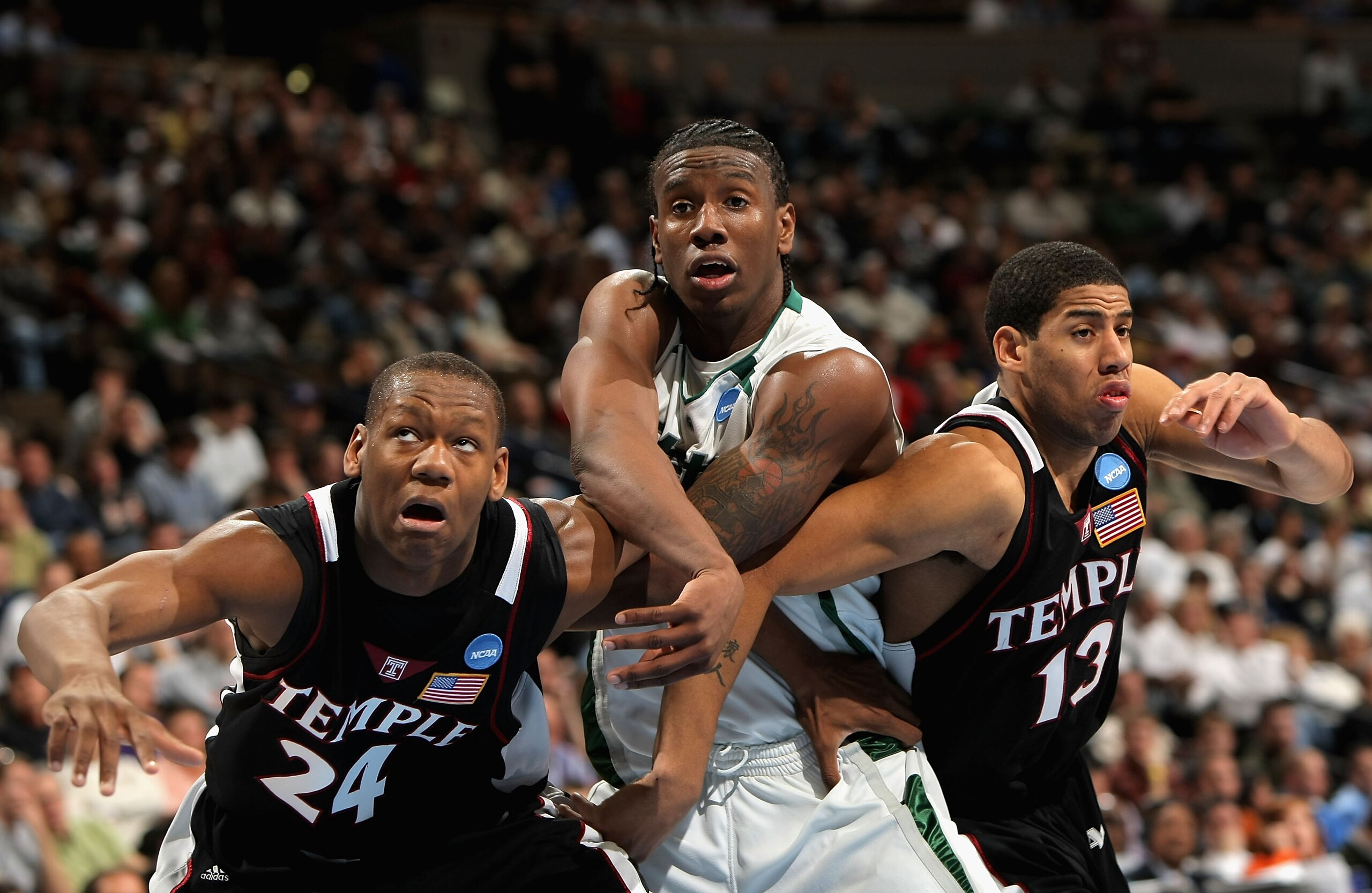 DENVER - MARCH 20:  Lavoy Allen #24 and Mark Tyndale #13 of the Temple Owls block out Raymar Morgan #2 of the Michigan State Spartans during a free throw shot at the first round of the South Regional as part of the 2008 NCAA Men's Basketball Tournament at