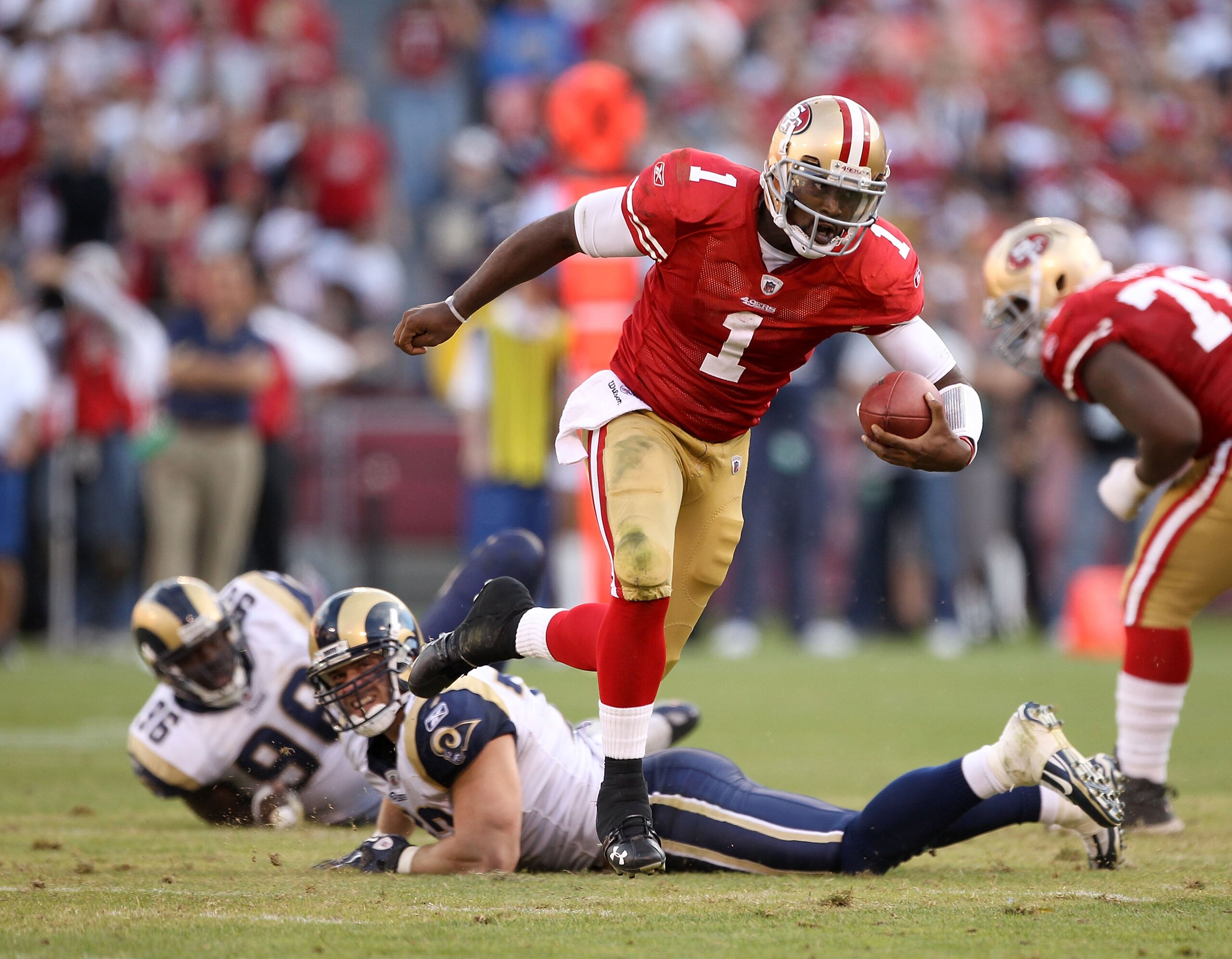 SAN FRANCISCO - NOVEMBER 14:  Troy Smith #49 of the San Francisco 49ers runs with the ball during their game against the St. Louis Rams at Candlestick Park on November 14, 2010 in San Francisco, California.  (Photo by Ezra Shaw/Getty Images)