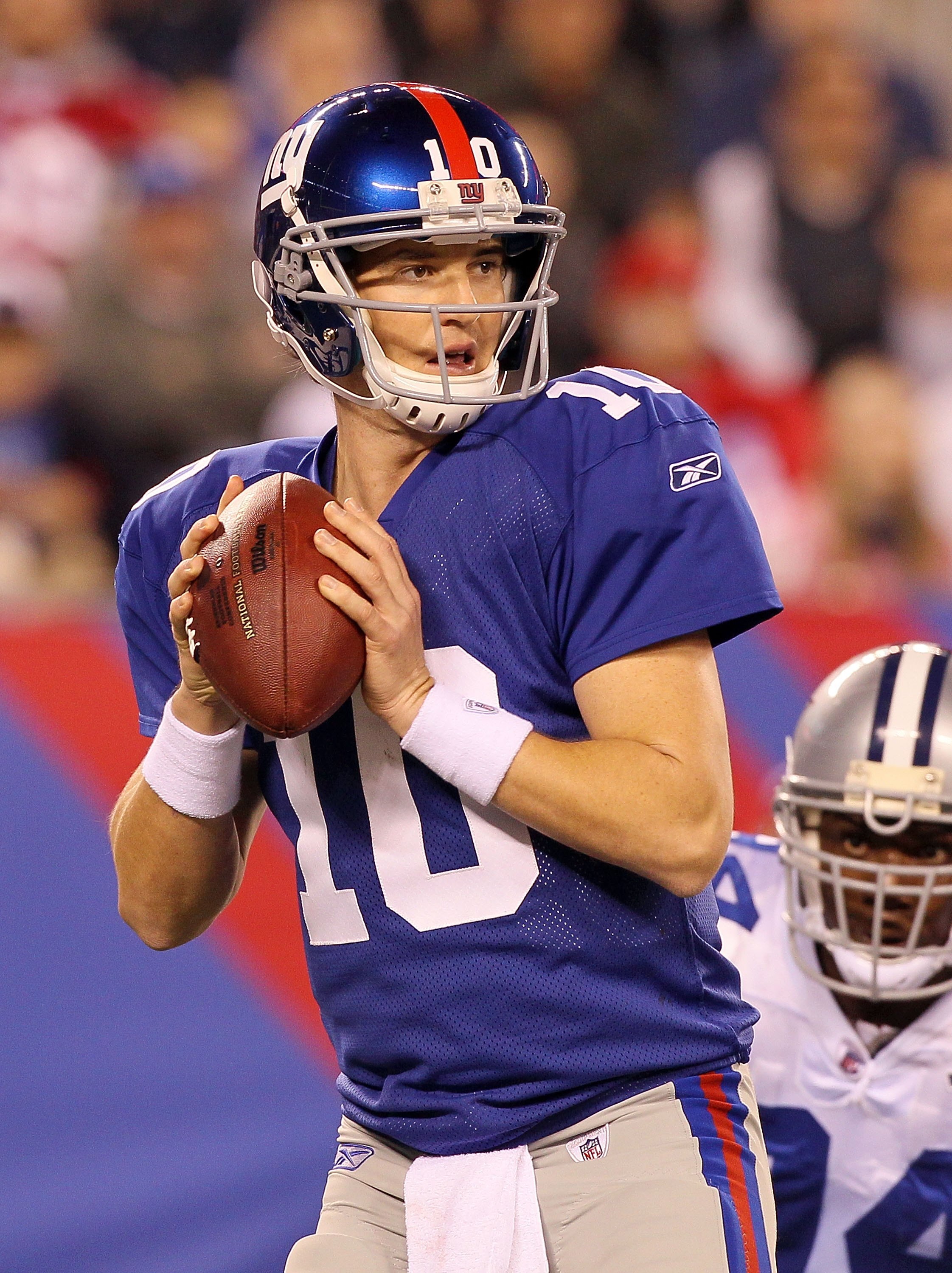 EAST RUTHERFORD, NJ - NOVEMBER 14:  Eli Manning #10 of the New York Giants throws a pass against the Dallas Cowboys on November 14, 2010 at the New Meadowlands Stadium in East Rutherford, New Jersey.  (Photo by Jim McIsaac/Getty Images)