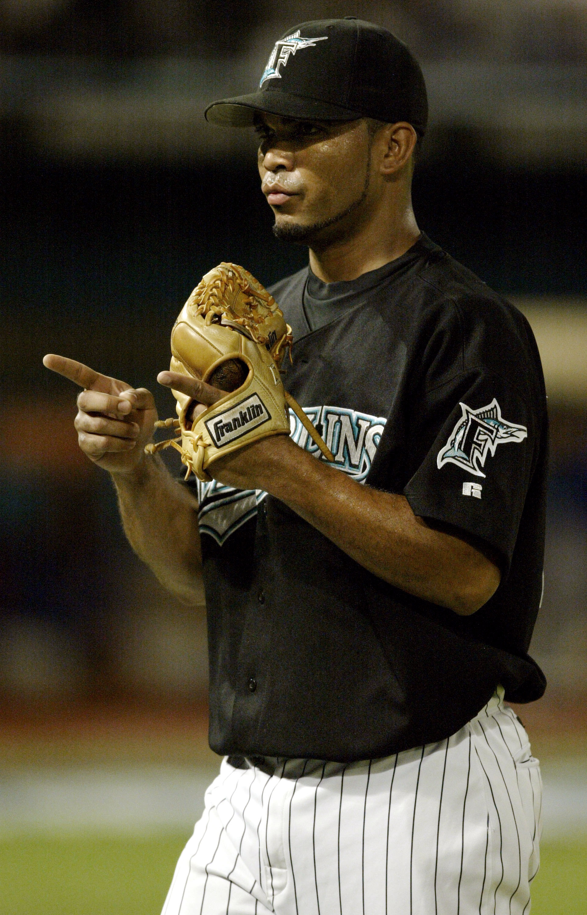 MIAMI - OCTOBER 10:  Pitcher Ugueth Urbina #74 of the Florida Marlins celebrates after ending an inning late in the game against the Chicago Cubs in game three of the National League Championship Series on October 10, 2003 at Pro Player Stadium in Miami,