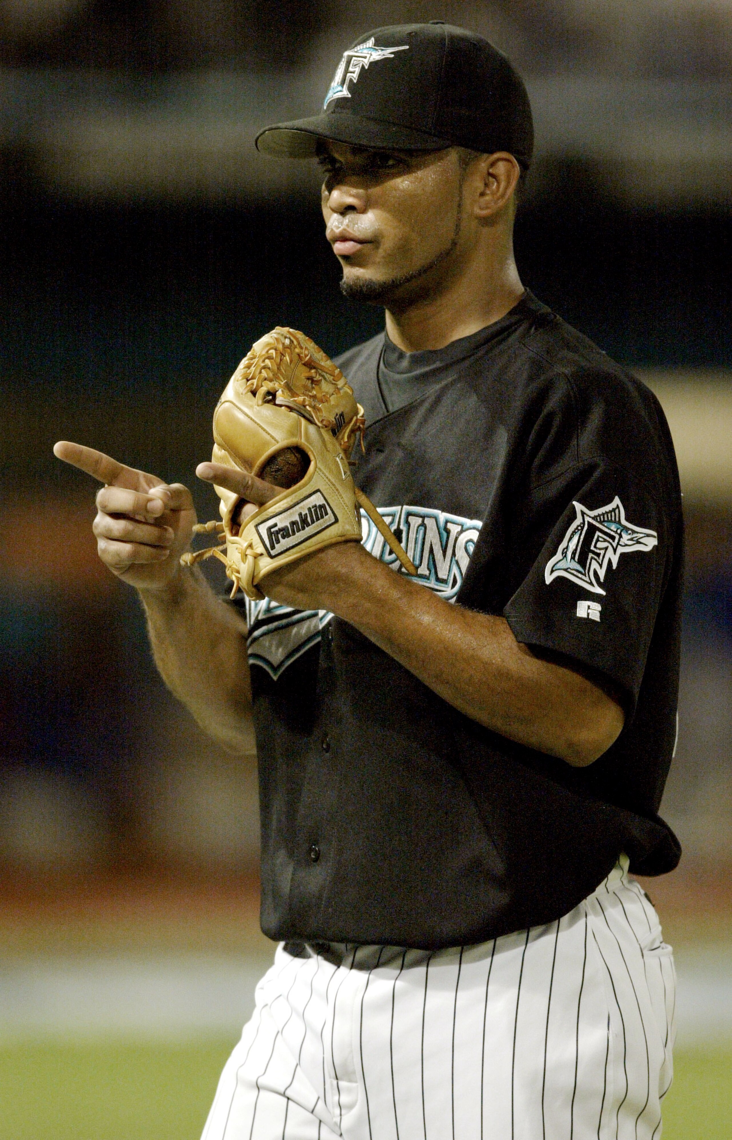MIAMI - OCTOBER 10: Pitcher Ugueth Urbina #74 of the Florida Marlins celebrates after ending an inning late in the game against the Chicago Cubs in game three of the National League Championship Series on October 10, 2003 at Pro Player Stadium in Miami, MIAMI - OCTOBER 10: Pitcher Ugueth Urbina #74 of the Florida Marlins celebrates after ending an inning late in the game against the Chicago Cubs in game three of the National League Championship Series on October 10, 2003 at Pro Player Stadium in Miami,