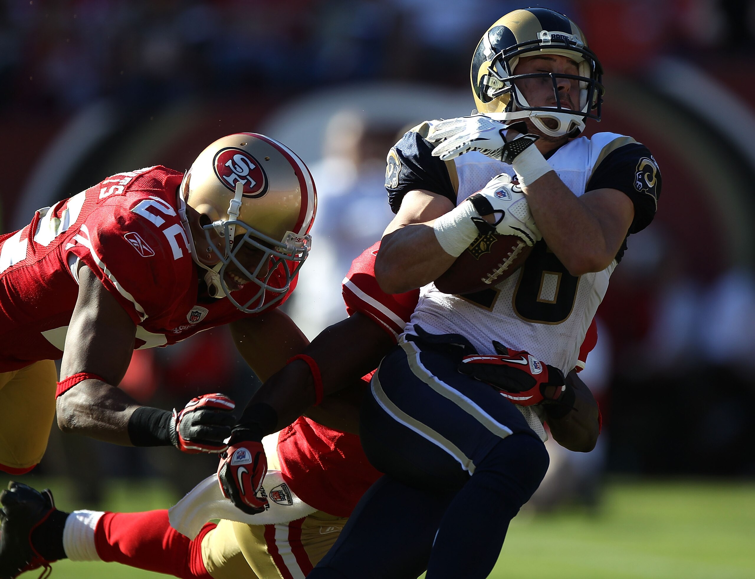 SAN FRANCISCO - NOVEMBER 14:  Danny Amendola #16 of the St. Louis Rams catchs a pass against Nate Clements #22 of the San Francisco 49ers during an NFL game at Candlestick Park on November 14, 2010 in San Francisco, California.  (Photo by Jed Jacobsohn/Ge