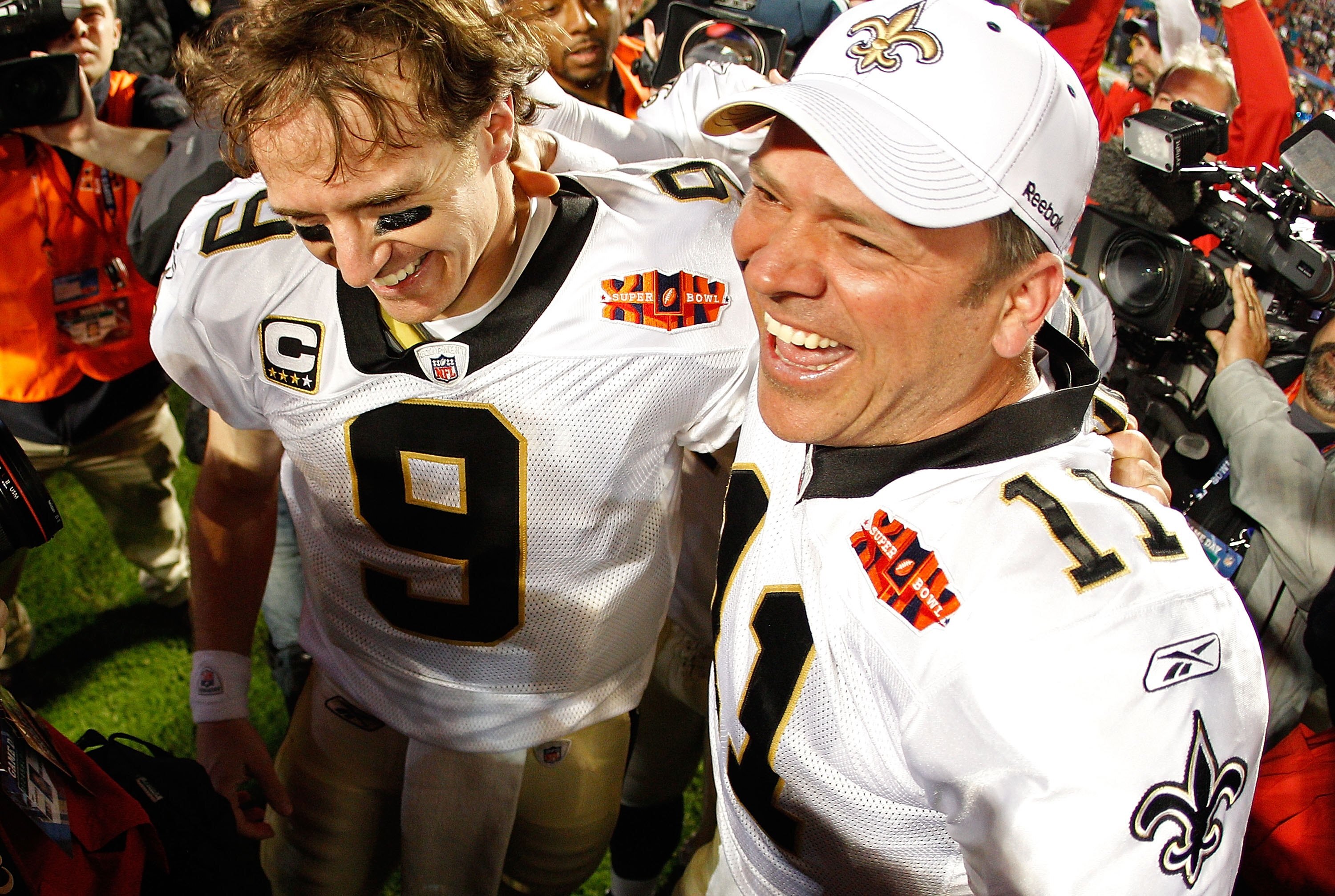 MIAMI GARDENS, FL - FEBRUARY 07:  Drew Brees #9 of the New Orleans Saints celebrates with Mark Brunell #11 after defeating the Indianapolis Colts during Super Bowl XLIV on February 7, 2010 at Sun Life Stadium in Miami Gardens, Florida.  (Photo by Chris Gr