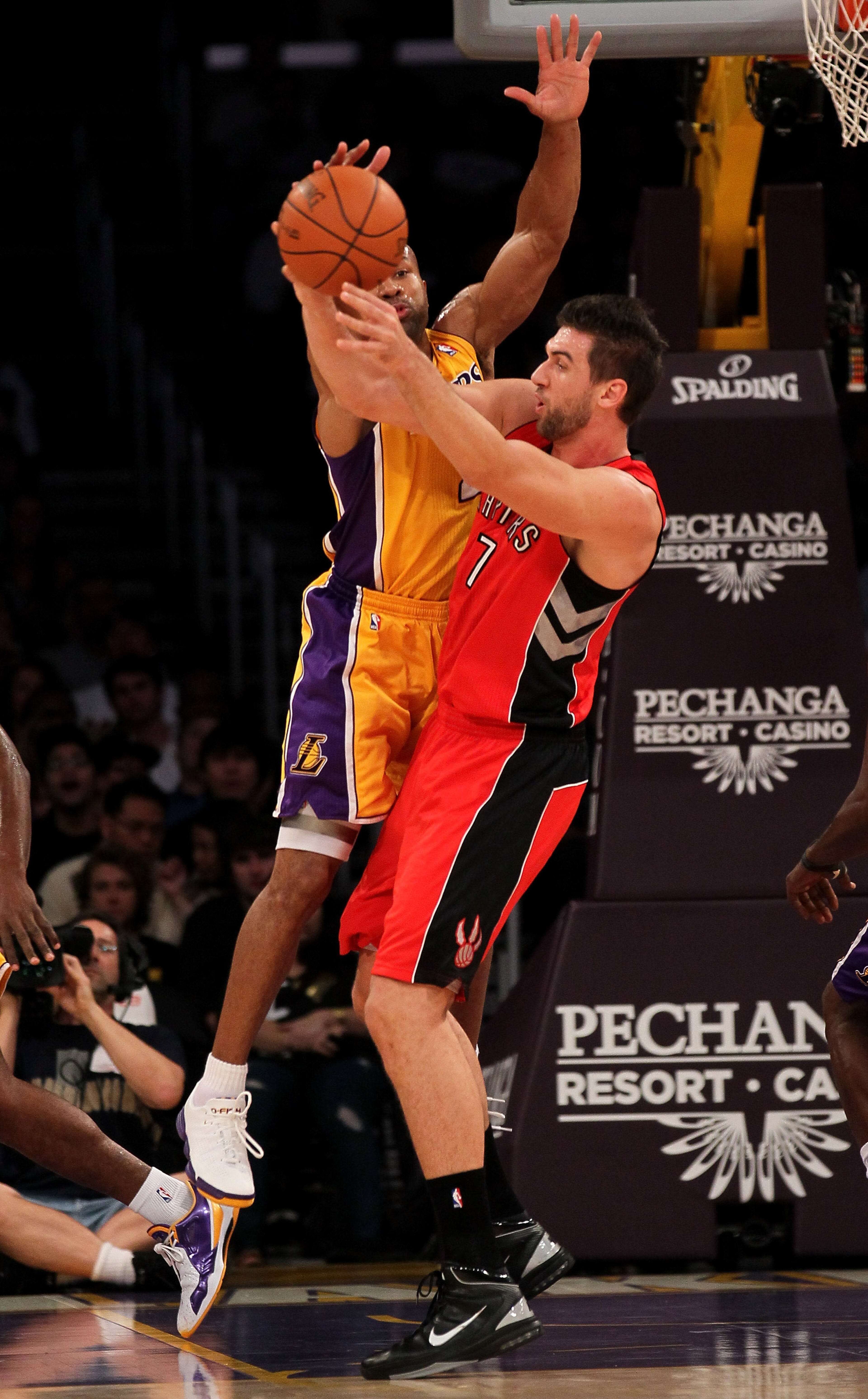 LOS ANGELES - NOVEMBER 5: Derek Fisher #2 of the Los Angeles Lakers strips the ball from Andrea Bargnani #7 of the Toronto Raptors at Staples Center on November 5, 2010 in Los Angeles, California. The Lakers won 108-102. NOTE TO USER: User expressly a LOS ANGELES - NOVEMBER 5: Derek Fisher #2 of the Los Angeles Lakers strips the ball from Andrea Bargnani #7 of the Toronto Raptors at Staples Center on November 5, 2010 in Los Angeles, California. The Lakers won 108-102. NOTE TO USER: User expressly a